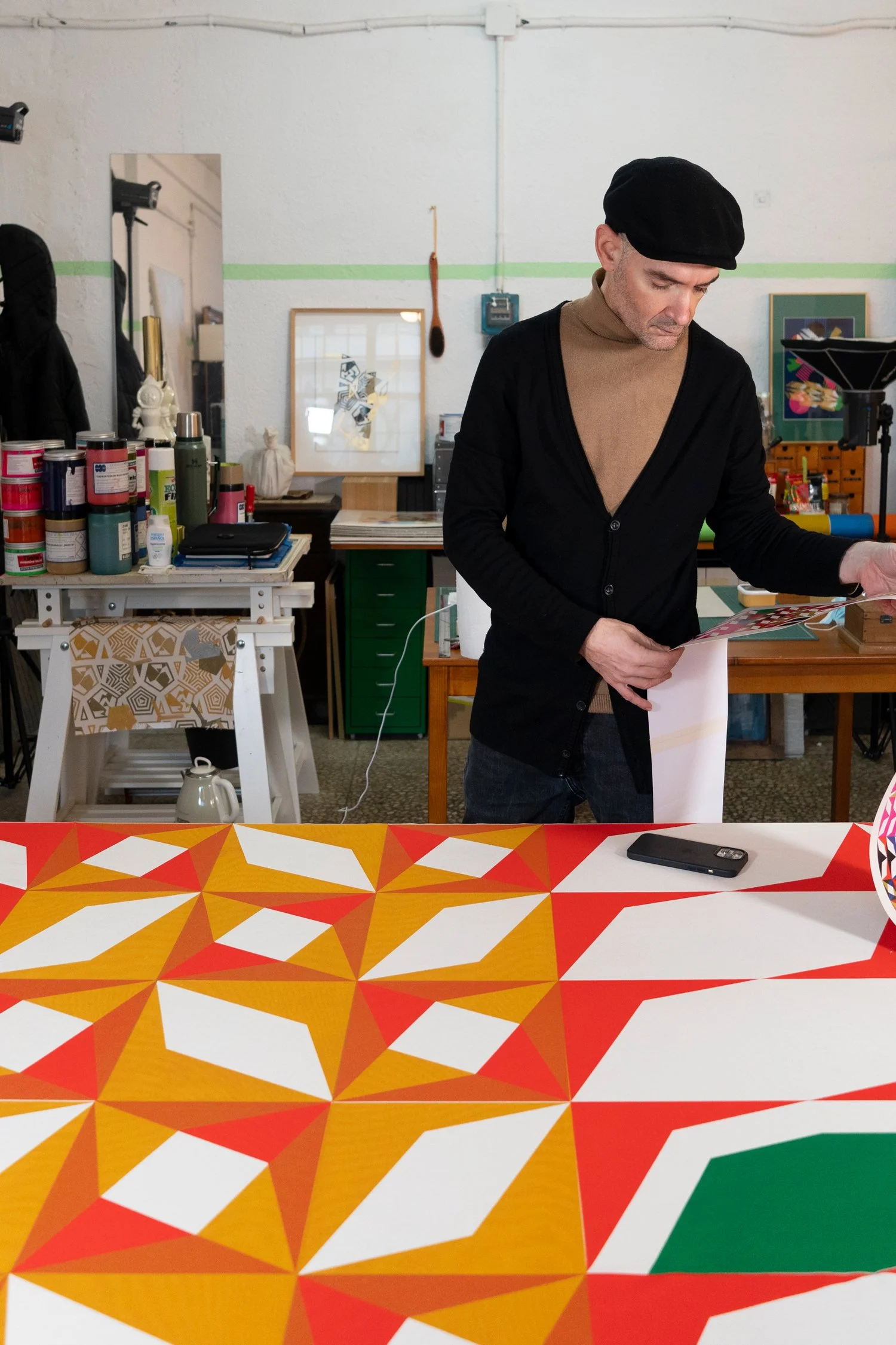 Working in the studio. Checking the printed sketch.