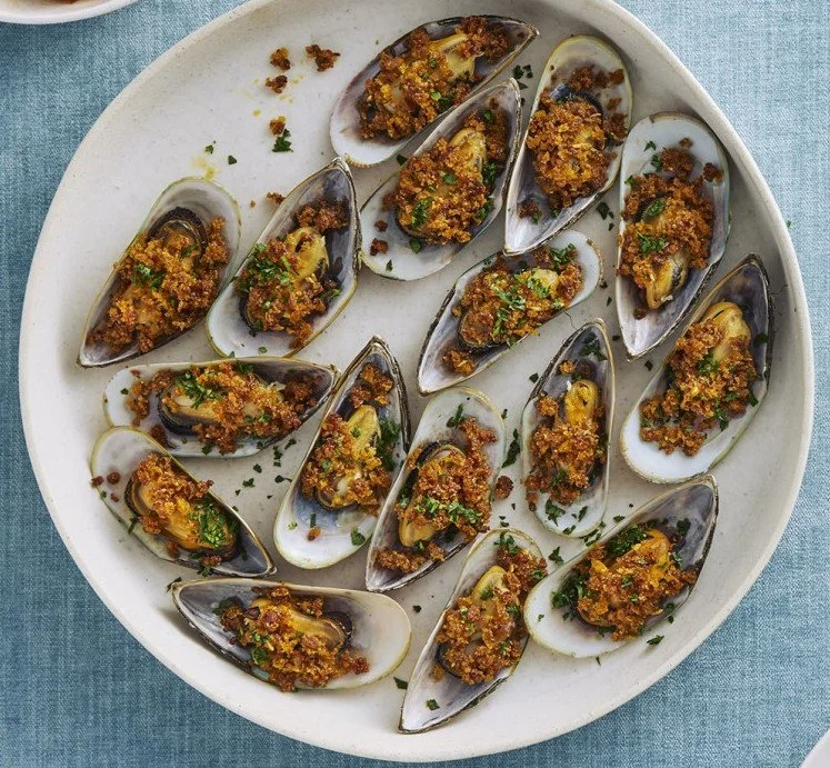 Grilled NZ Greenshell mussels with crispy chorizo, parmesan and fennel crumb