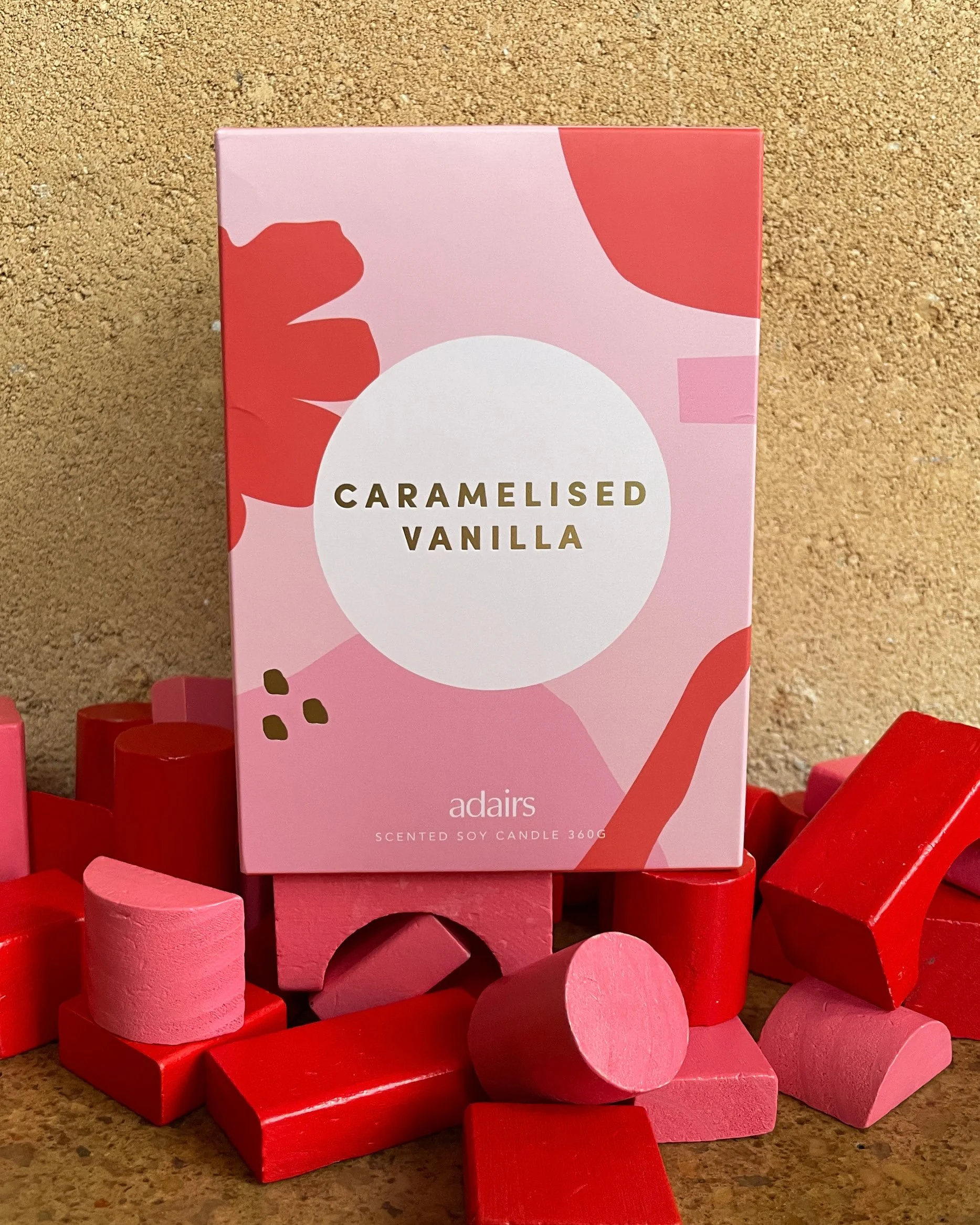 Packaging design commission for Adairs home fragrance range, featuring pink and red abstract artwork by Melbourne contemporary artist Jess Lowther. (Hoffy)