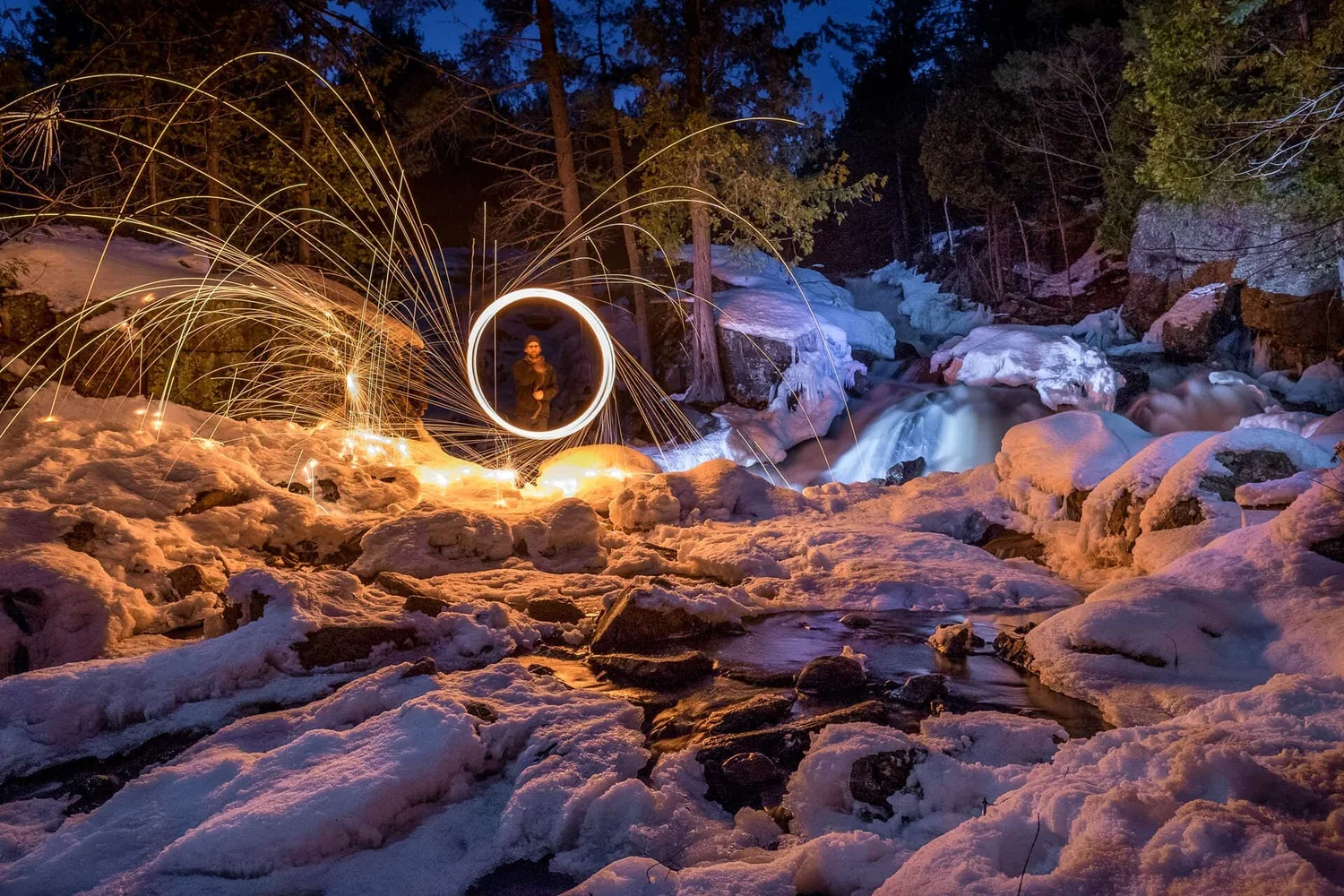 Steel wool photography — winter night creek sparks
