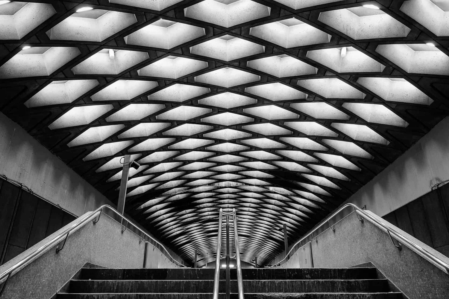 Métro Champ-de-Mars — teal curved tile wall, blurred train