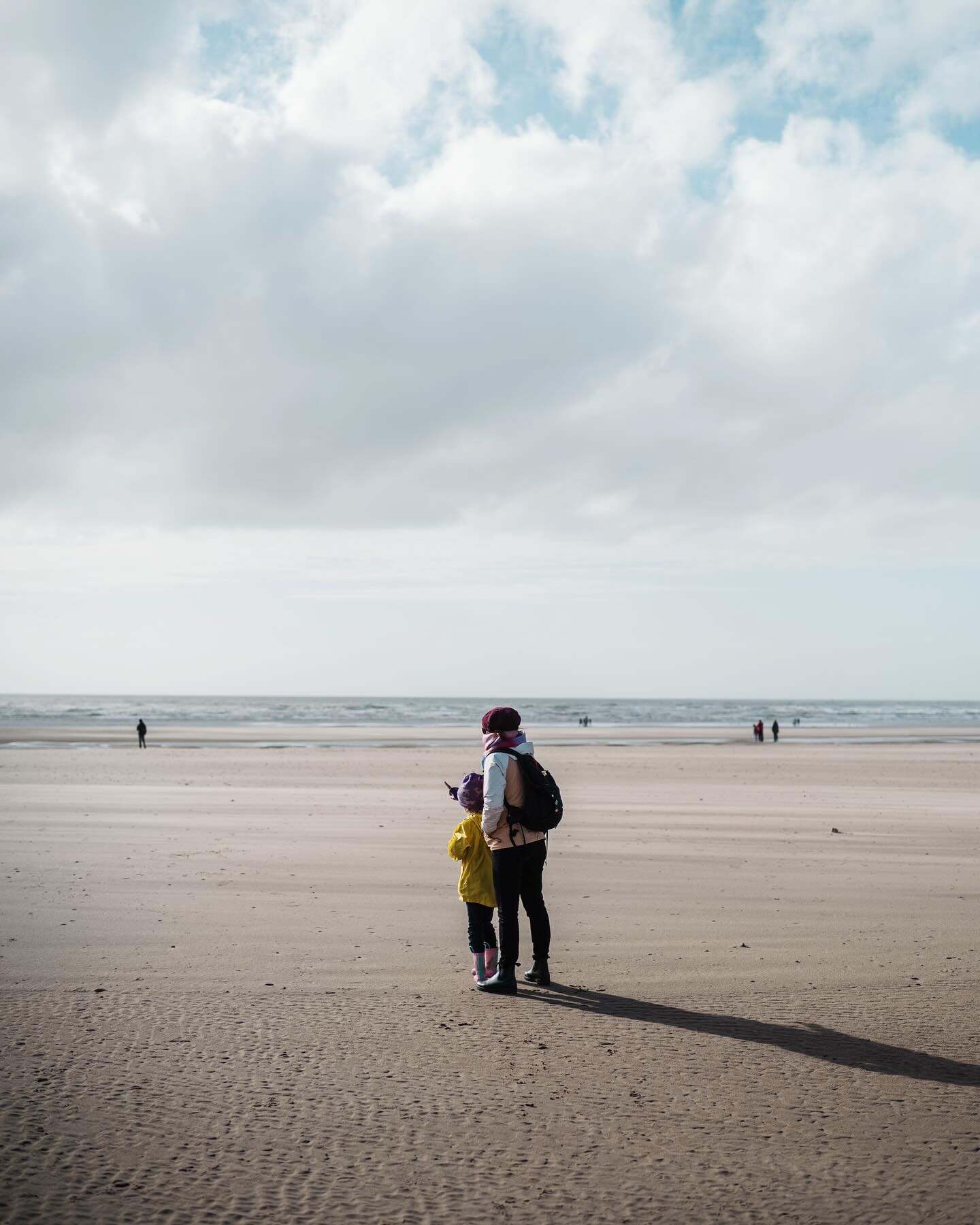 Blackpool. Here the wind that had followed us down from the Scottish Highlands blows ribbons of sand along the endless wide beach. I'm reminded of the way the wind would blow snow across frozen Lake Nipissing when I would ski out there to photograph 