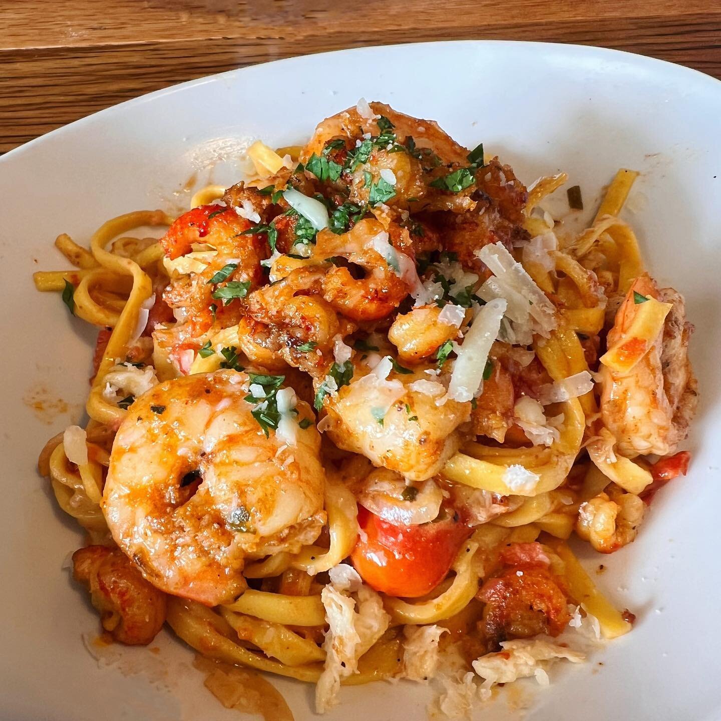 Seafood pasta | Crawfish tails, marinated shrimp, crab meat served with a blistered tomato cream sauce, fettuccine &amp; tuscan kale