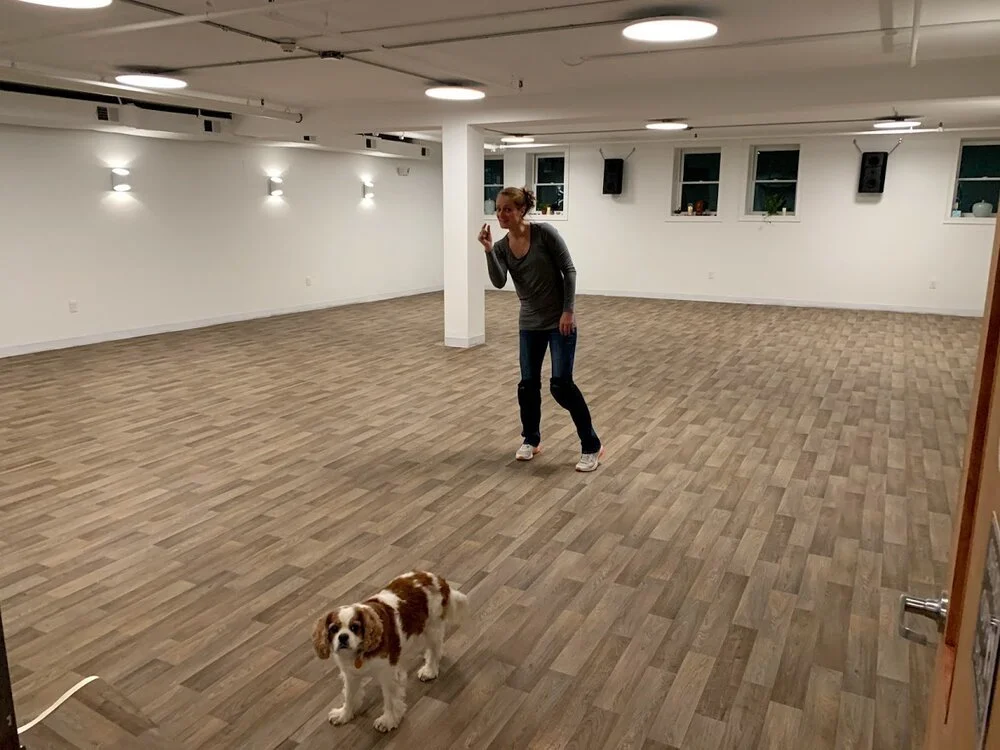 Naama and Em happy in Riverside after installing flooring