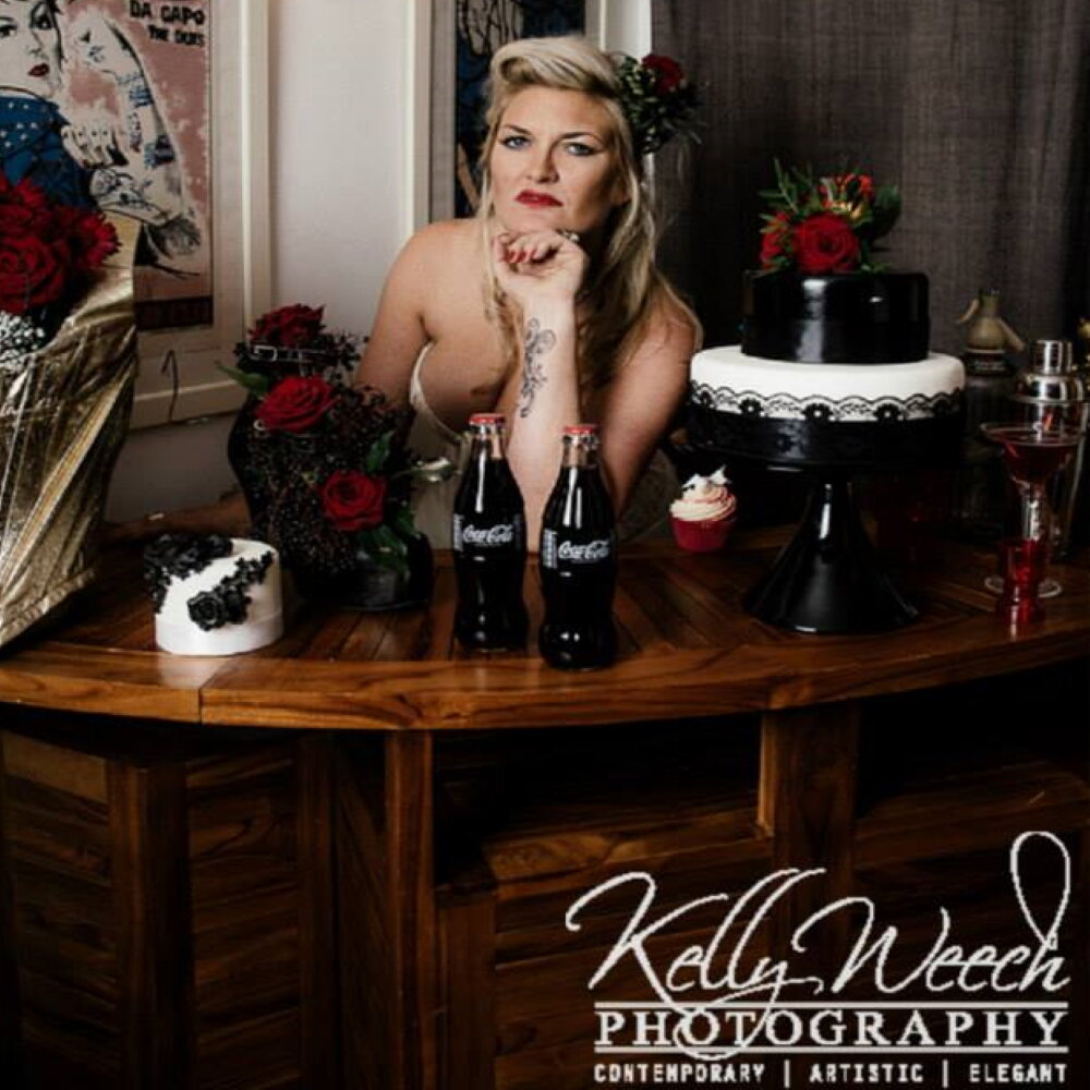  model Sara from Electric Vintage tattoo shop photographed for a rock no roll wedding shoot at Mill End Mitcheldean in Gloucestershire with styling by Liz Lewitt including wedding cake - photographed by Kelly Weech 