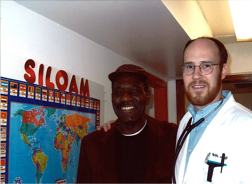 Morgan and patient at original Siloam clinic.jpg