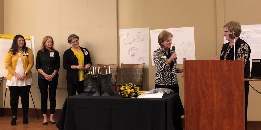 Mary announcing leadership recognition at shared leadership retreat 2018.jpg