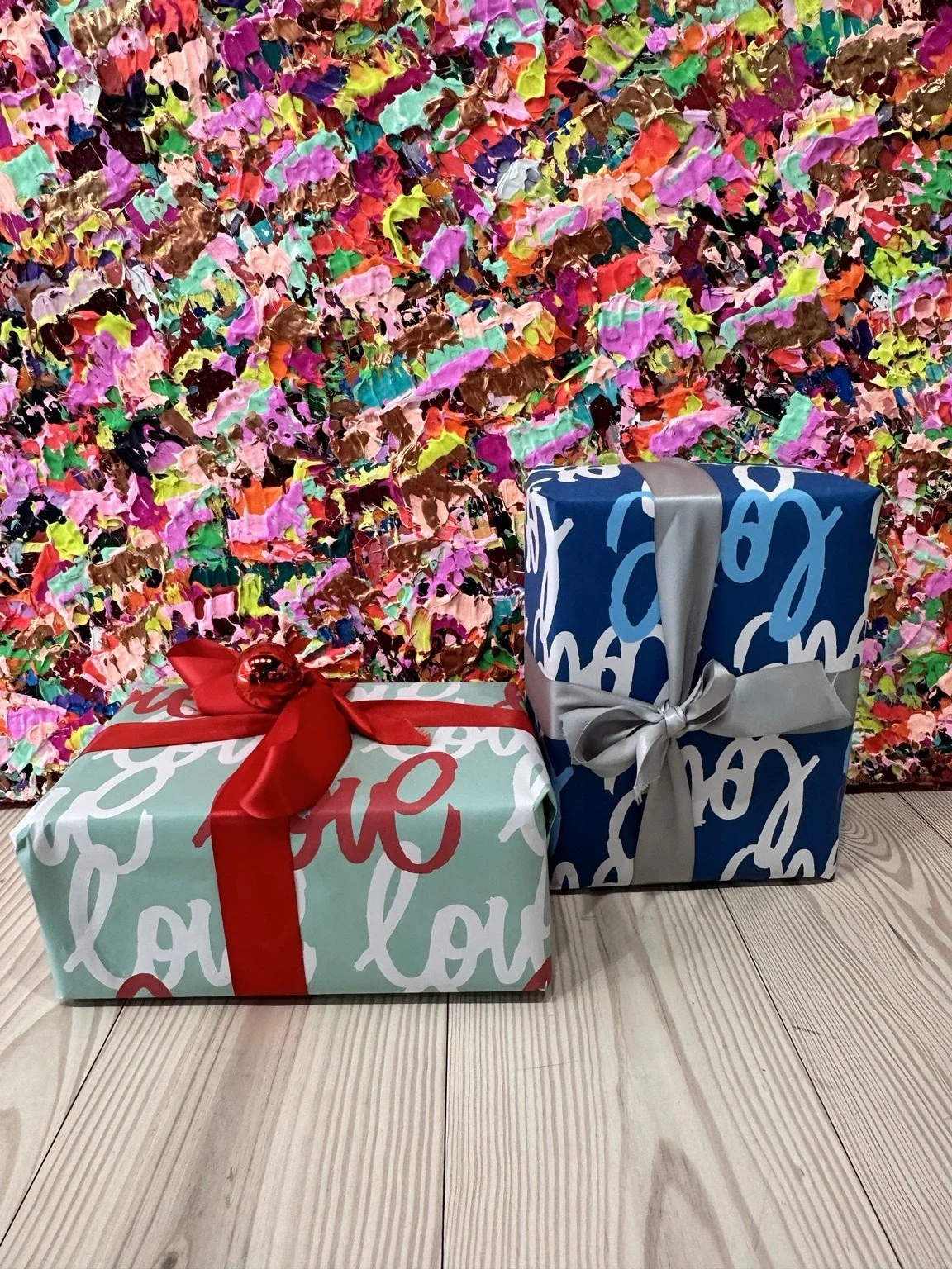 Gifts wrapped in the two custom Love Always paper designs from a past fundraising campaign.