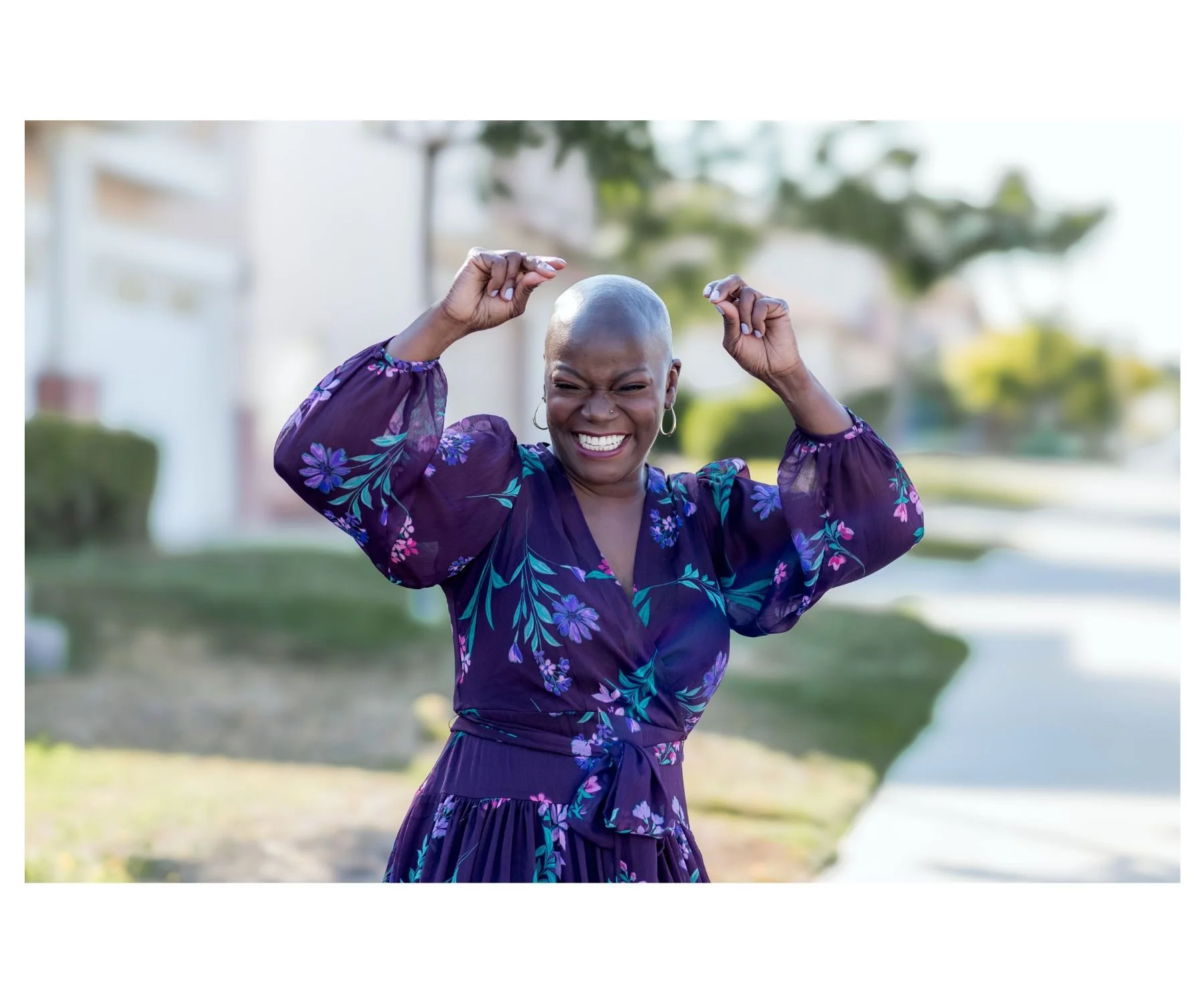 Woman dancing joyfully with arms raised during a San Diego empowerment photoshoot