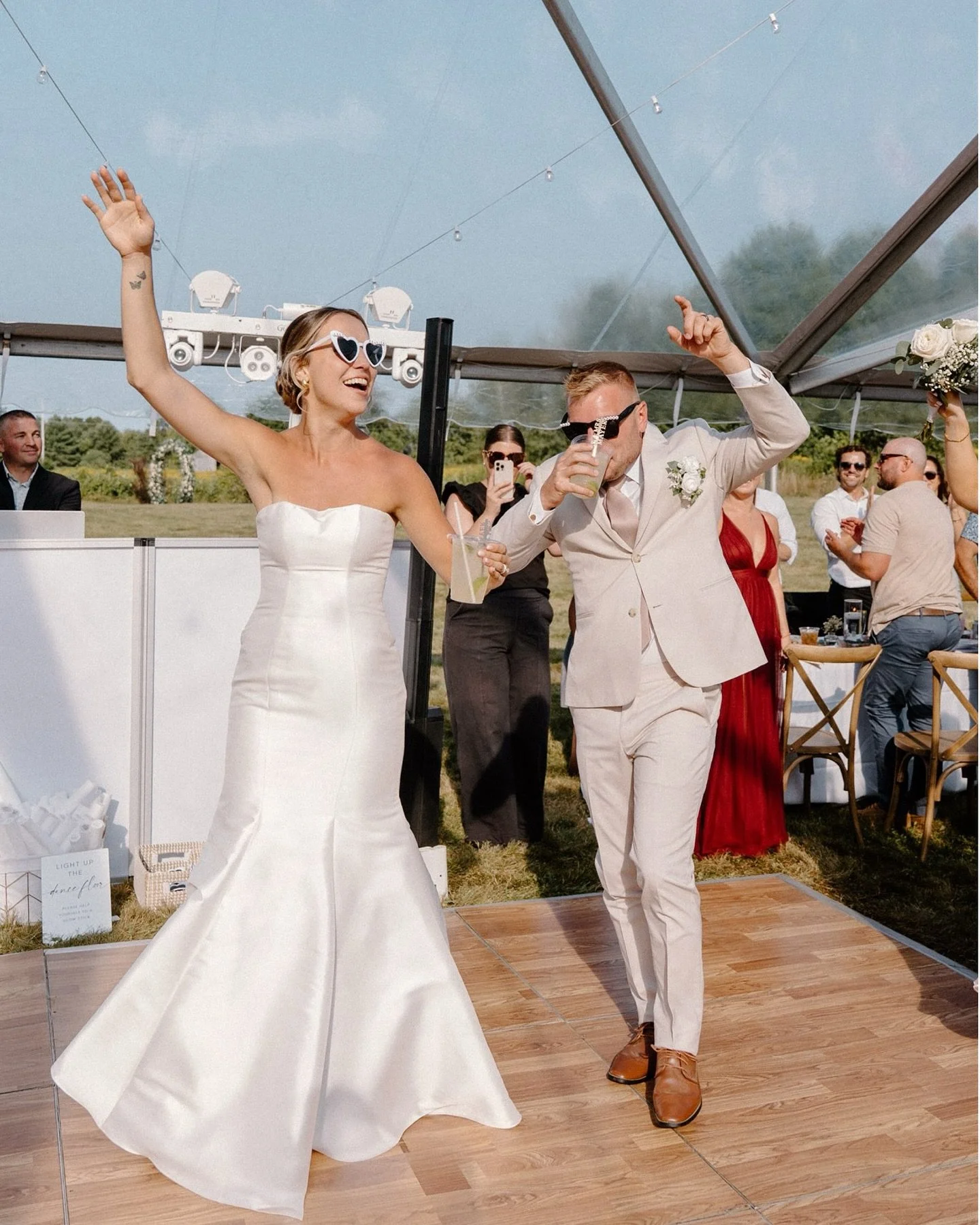 Rachel and Sam celebrated their love on a perfect summer day, surprising their friends and family with the news that they had eloped a little while ago. They saved their ring exchange for this special moment, surrounded by loved ones, before hitting 