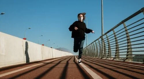 a man riding a skateboard on a rail