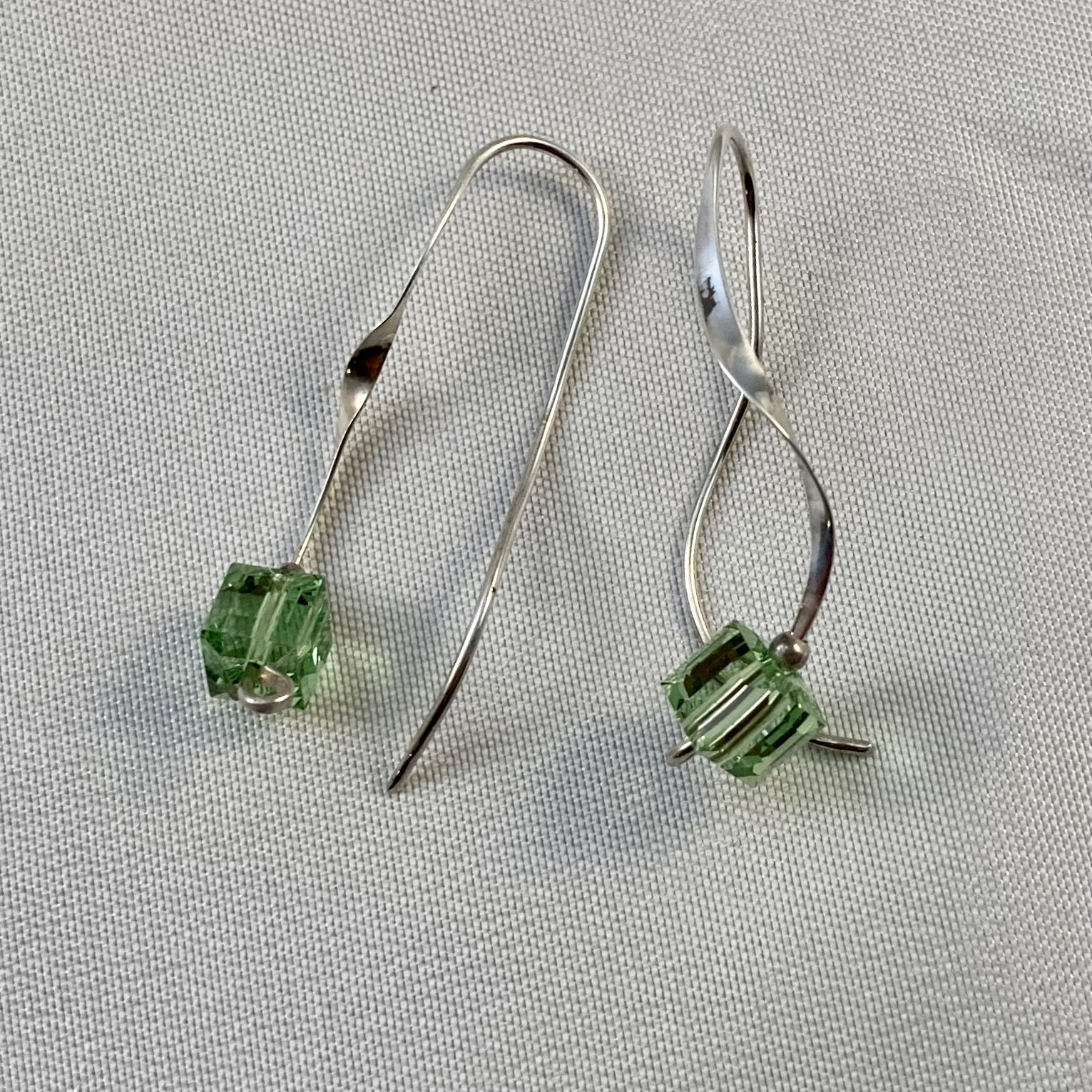 Earrings with green crystal.