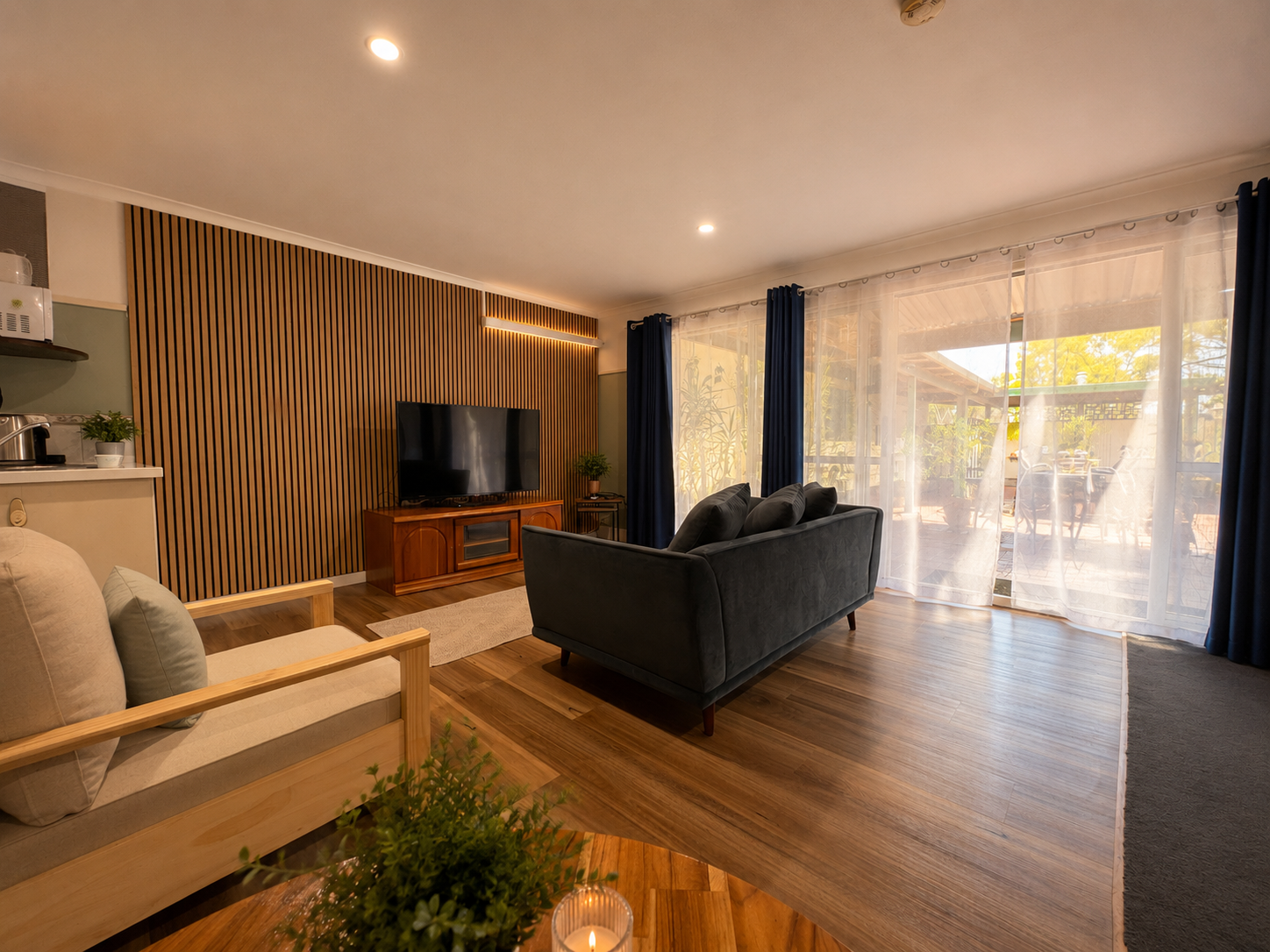 Orchard King Studio living area opening onto the private patio and garden at Pecan Hill