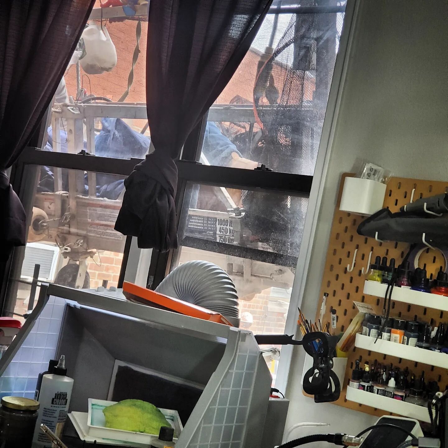 I have, in the past, complained about working from home and how I missed having people around. Today there's a work crew suspended seven stories up, just outside my studio window. Using very loud power tools on the wall a few feet away from me. Might