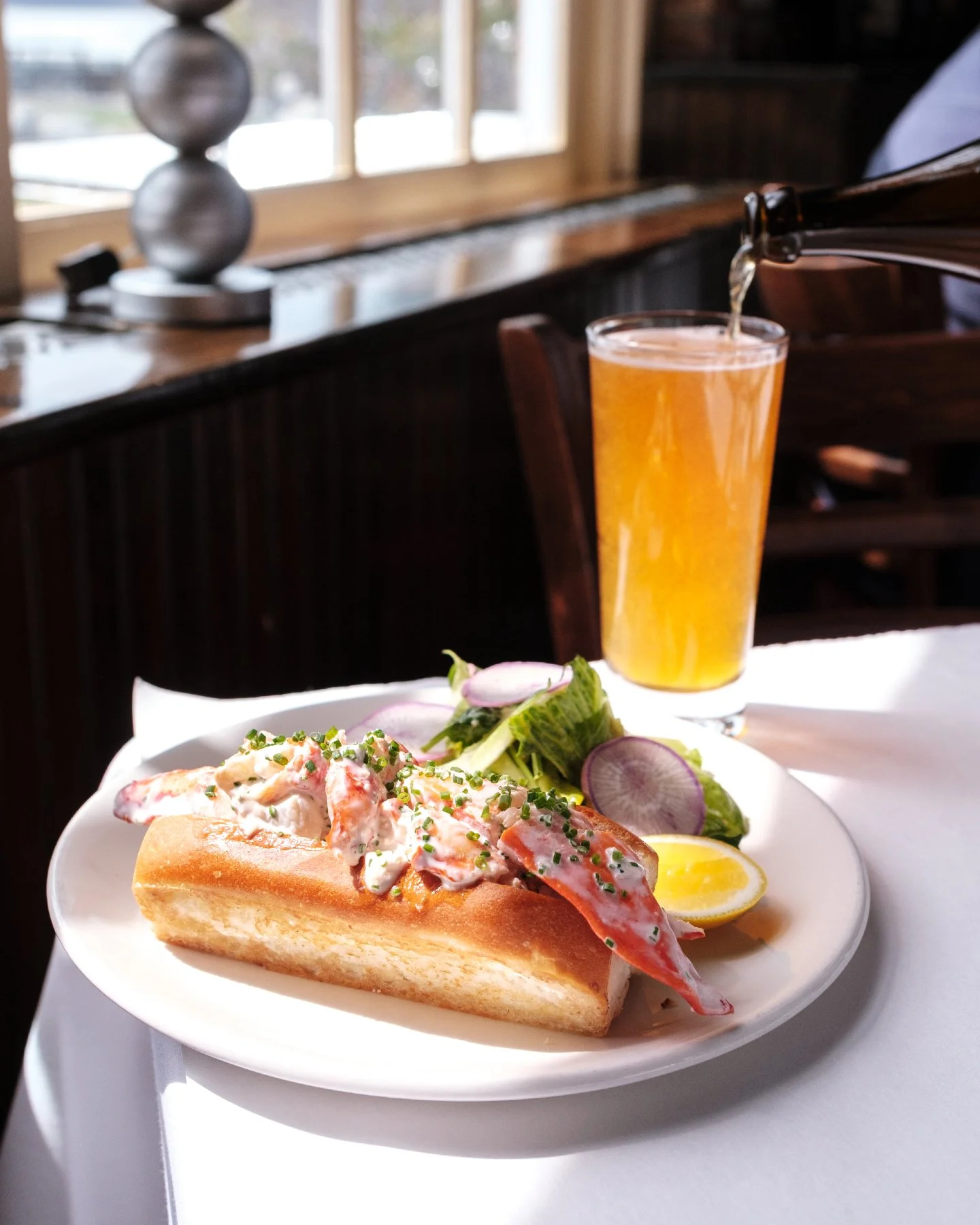 Lobster roll season has officially arrived 🦞☀️

Our Maine Style Lobster Roll is made with fresh lobster, mayo, lemon, and chives on a toasted brioche roll &mdash; best enjoyed out on the patio with a view of the Hudson. Served with your choice of gr