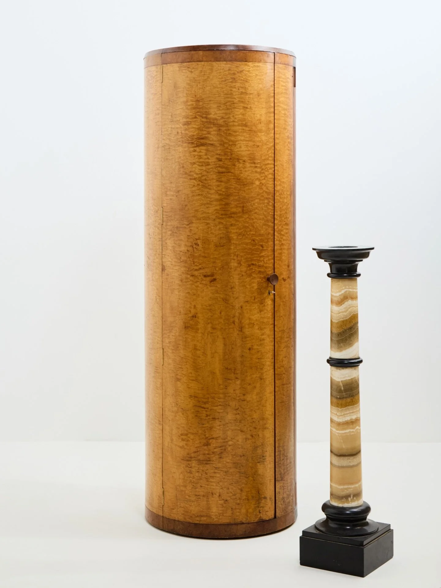 A superb British 1930s Art Deco cylindrical cabinet.

The fish scale like surface is Hungarian Ash. It&rsquo;s iridescent!

There&rsquo;s 5x adjustable circular shelves, plus a hanging rail. Which might make this the most versatile ex-cocktail cabine