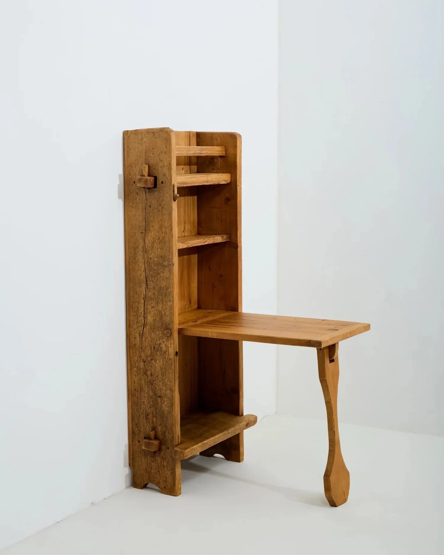 The breakfast nook I&rsquo;ve always dreamed of..

Metamorphic shelves which fold out into a small dining table. Constructed in thick douglas fir timber.
Reputedly from the Alpine town of Courcheval. 

France 1960s.