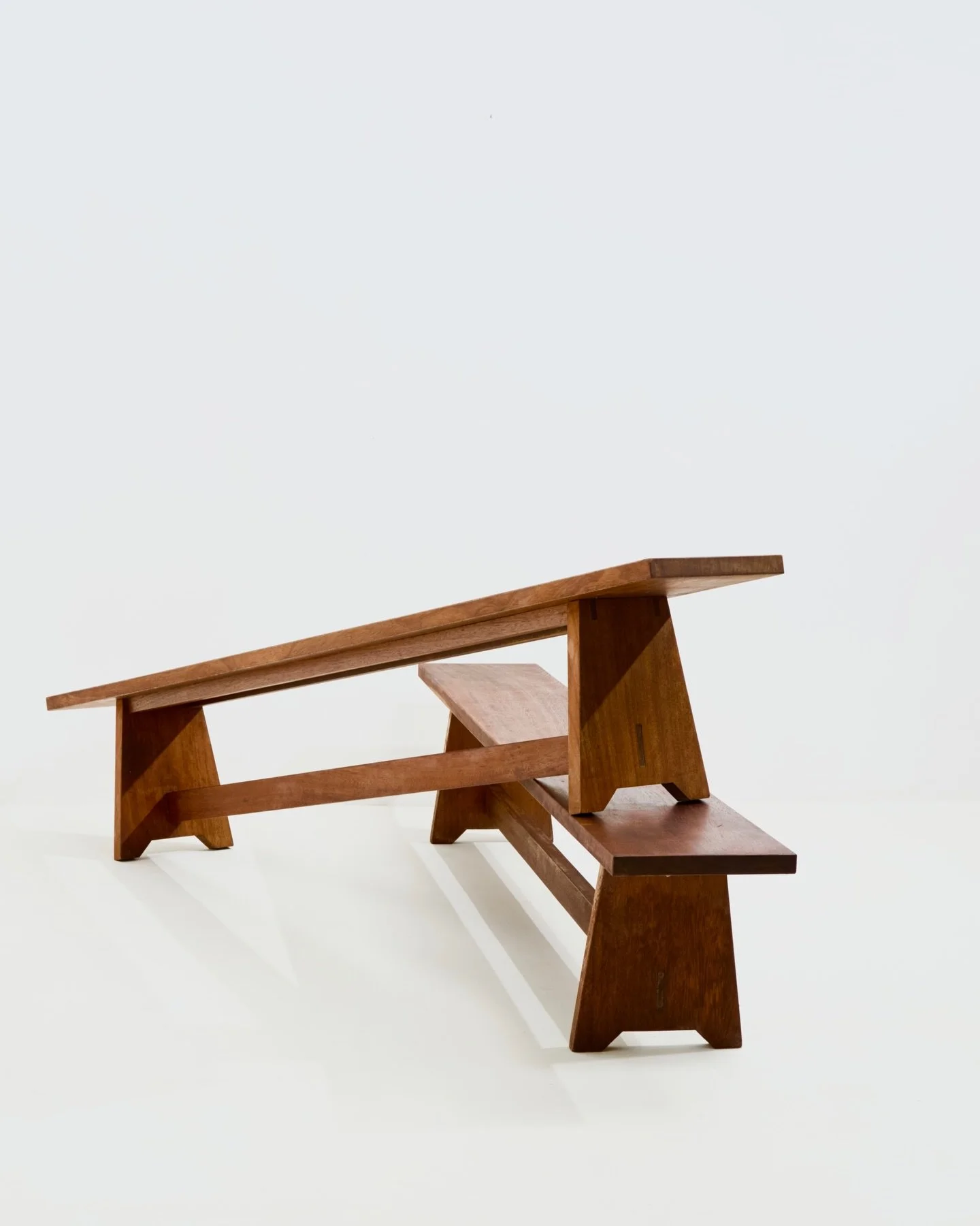 Super pair of reclaimed iroko benches with a subtle nod  to modernist design. With each measuring over 220cm long, they happily fit 4/5 ppl for dinner.

Bought in the Highlands of Scotland. Now back in our North London studio, where it's possible com