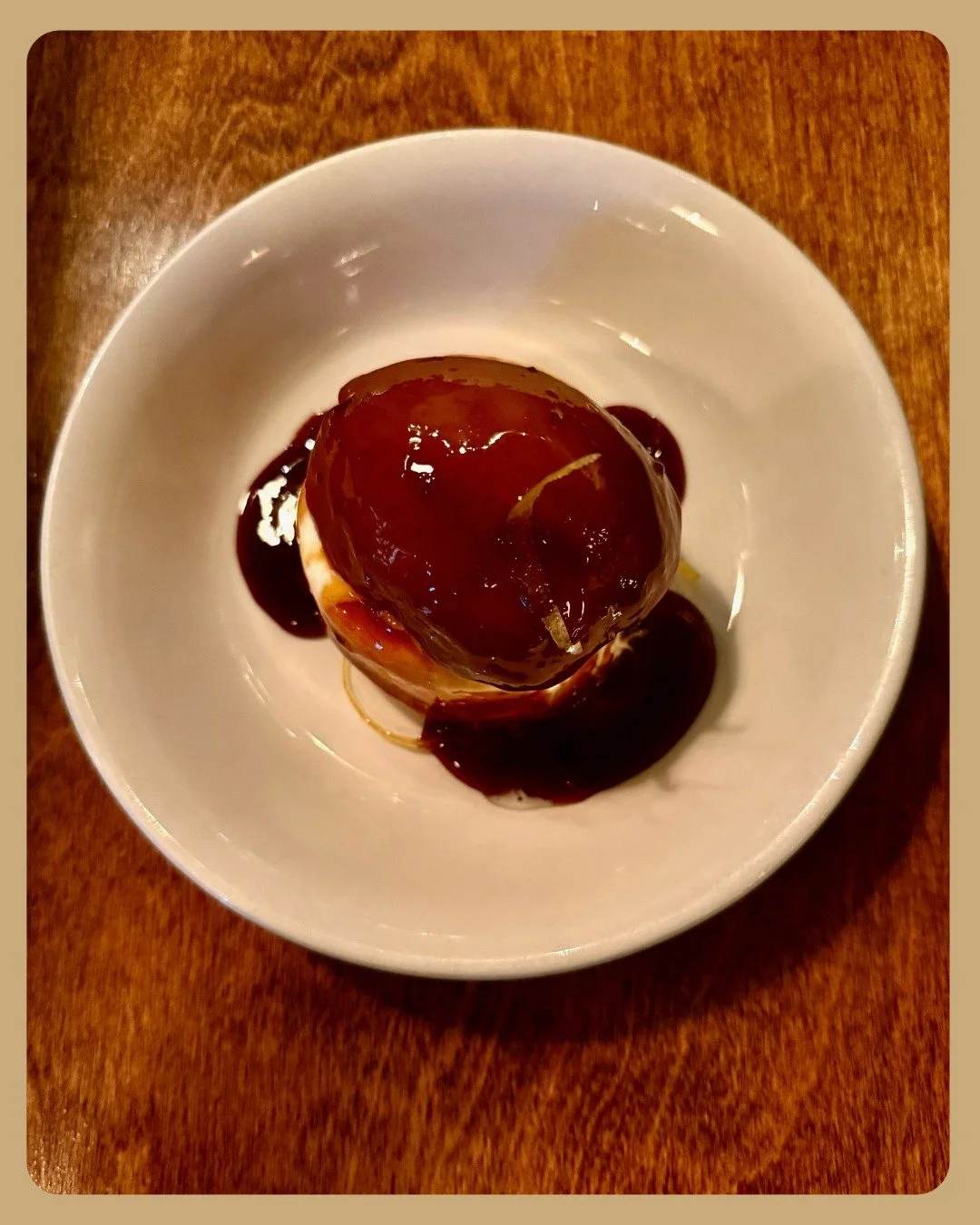 A warm marsala wine poached pear, glazed with the reduced poaching liquid, perched on vanilla ice cream with a pine nut amaretti cookie base. Garnished with candied lemon. 

It's fall. It's brown season. And brown tastes delicious.