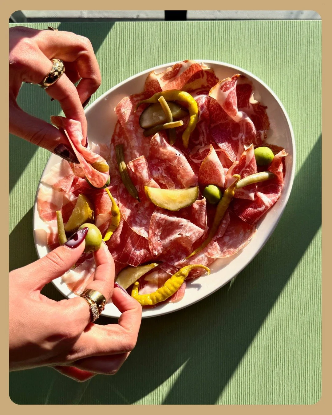 We're making meat waves.... our charcuterie plate, with three rotating selections of salumi, alongside a few pickles and olives. Best way to do it is make a little meat wrap with a pickle in it while slinging back a cider or some bubs but hey there a