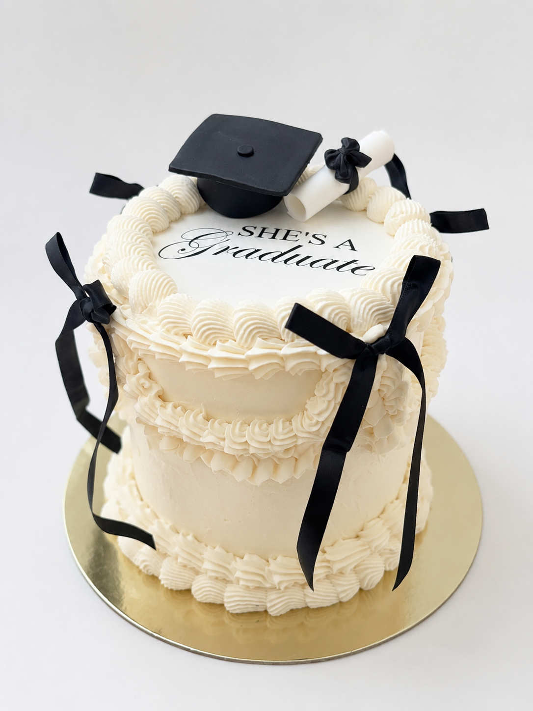 black and white elegant graduation custom cake with bows