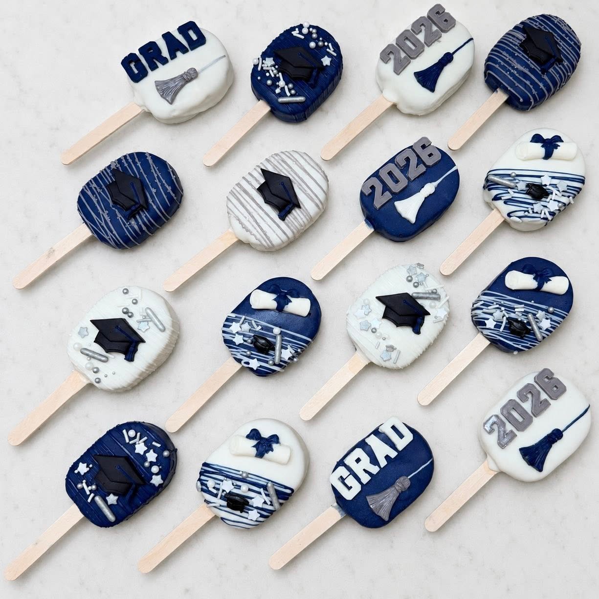 Silver, Navy, and White Graduation cakesicles