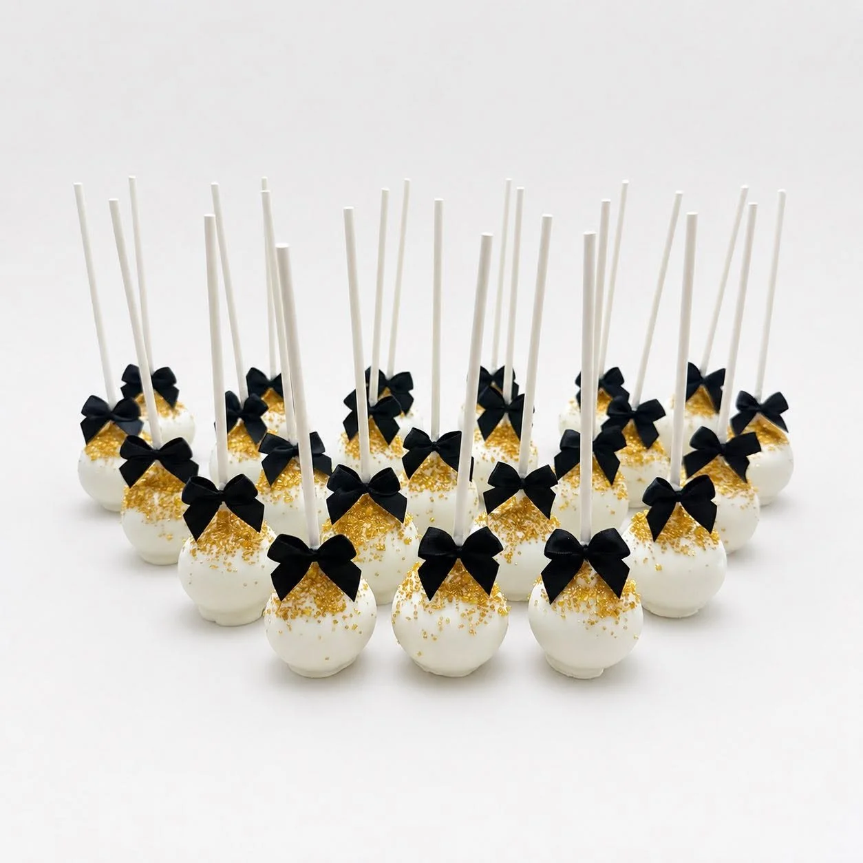 Black, white, and gold elegant graduation cake pops