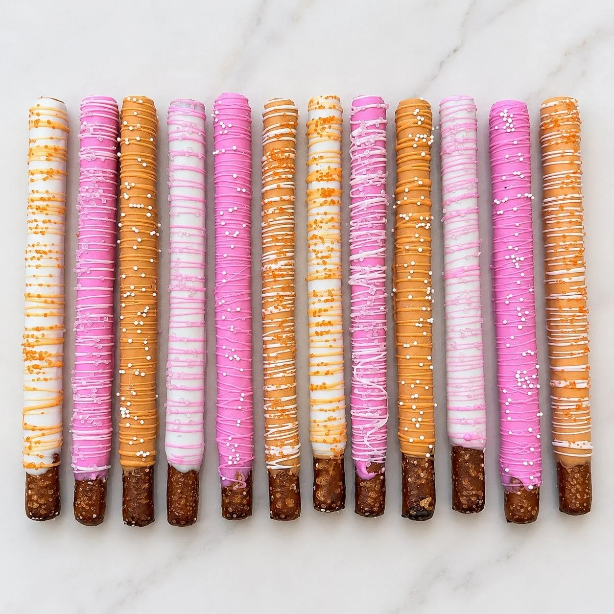 Bright Pink and Orange Dipped Pretzel Rods