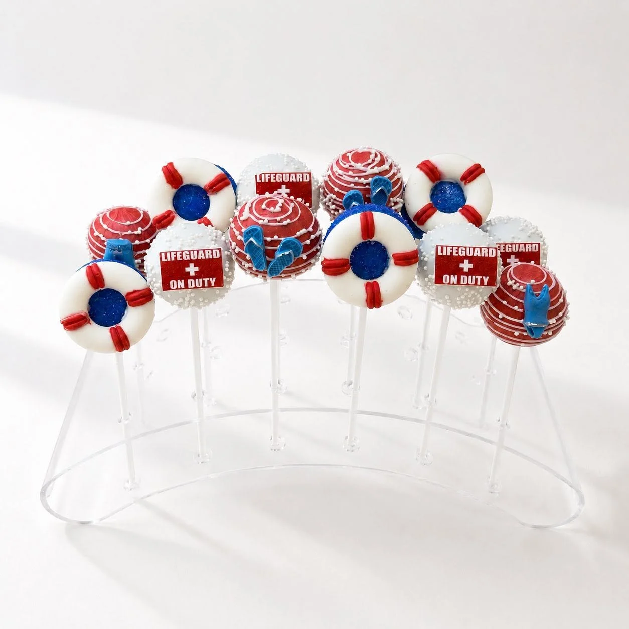 Lifeguard Theme Summer Cake Pops in stand
