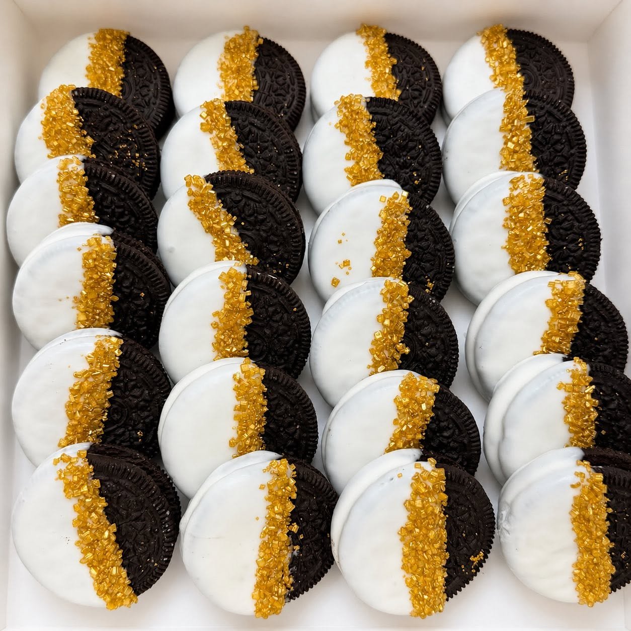 Black, white, and gold elegant chocolate covered oreos
