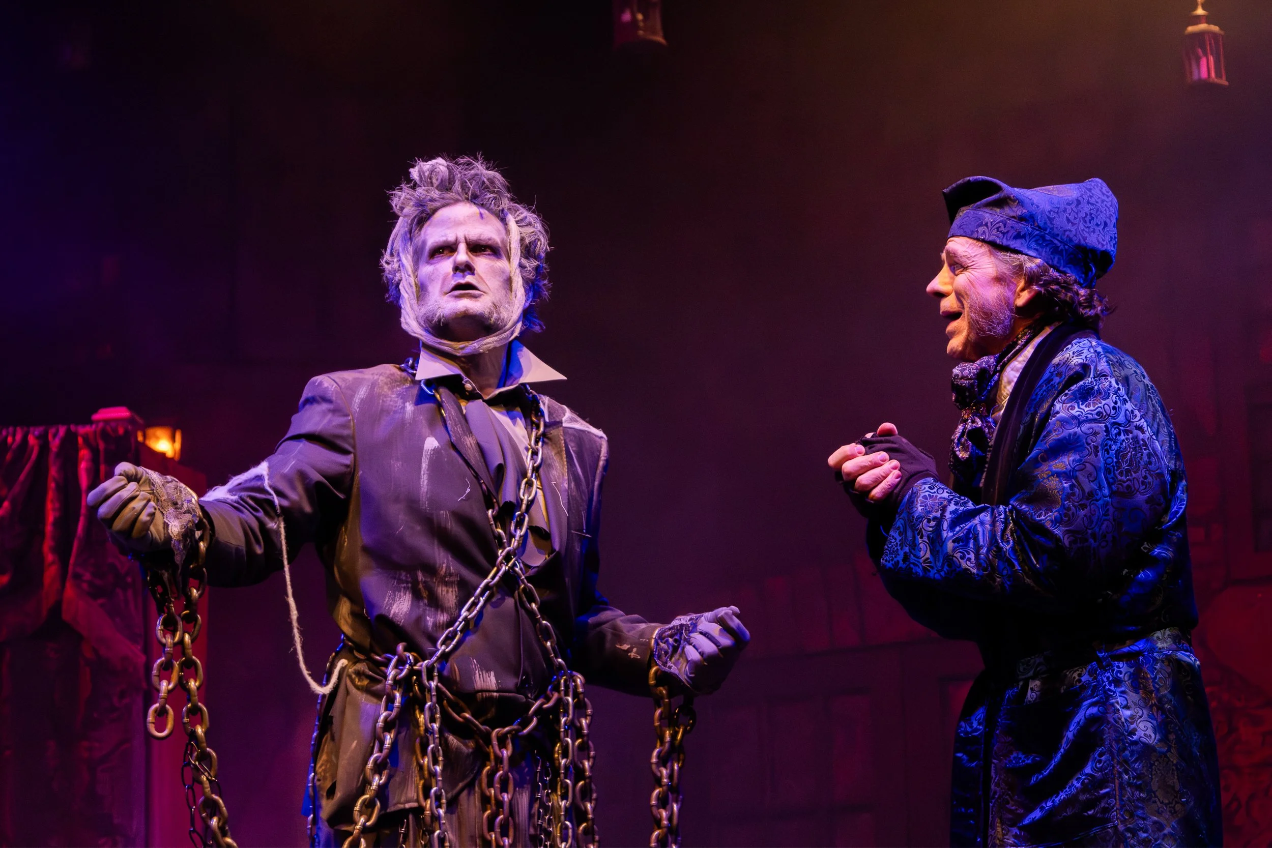 Jacob Marley in chains appearing to Scrooge in A Christmas Carol.