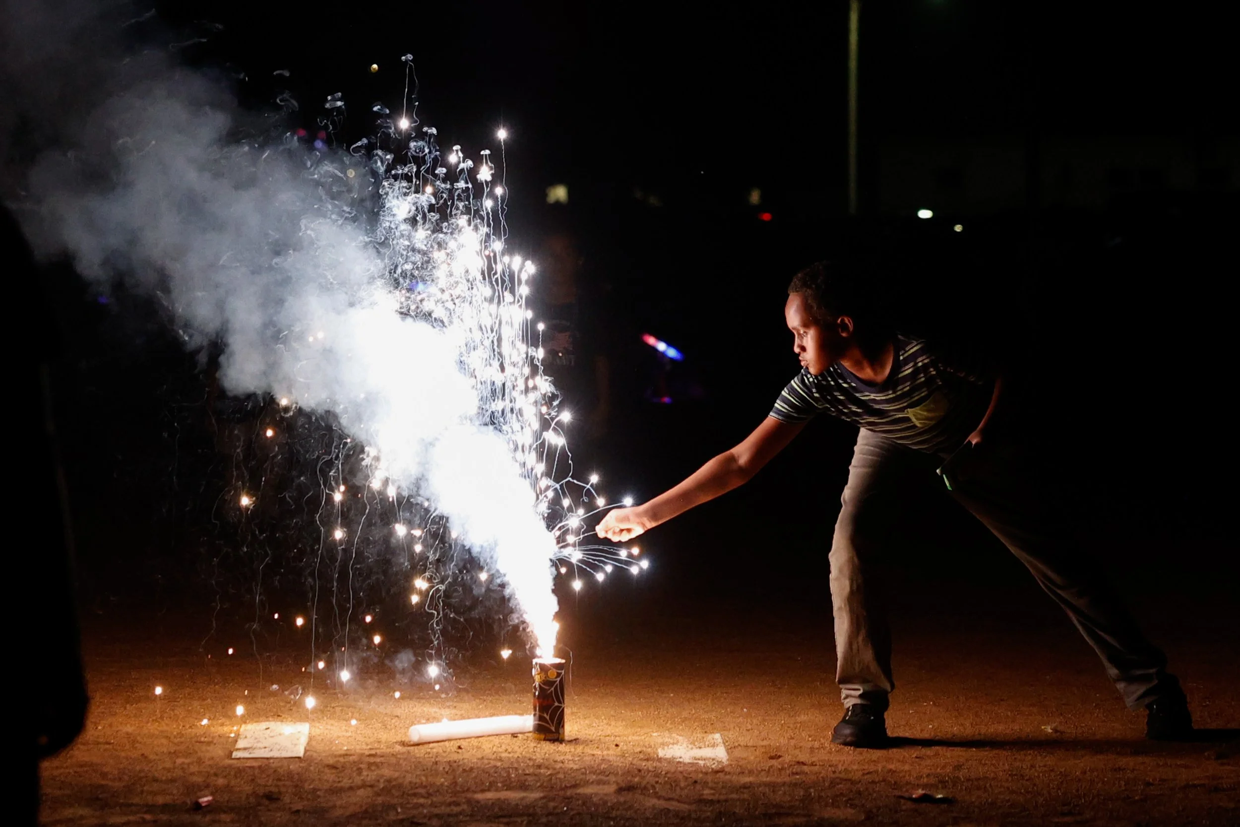 A child sets off a sparkler during Rochester’s 4th Fest on Saturday, July 4, 2026, at Soldiers Field Park in Rochester.