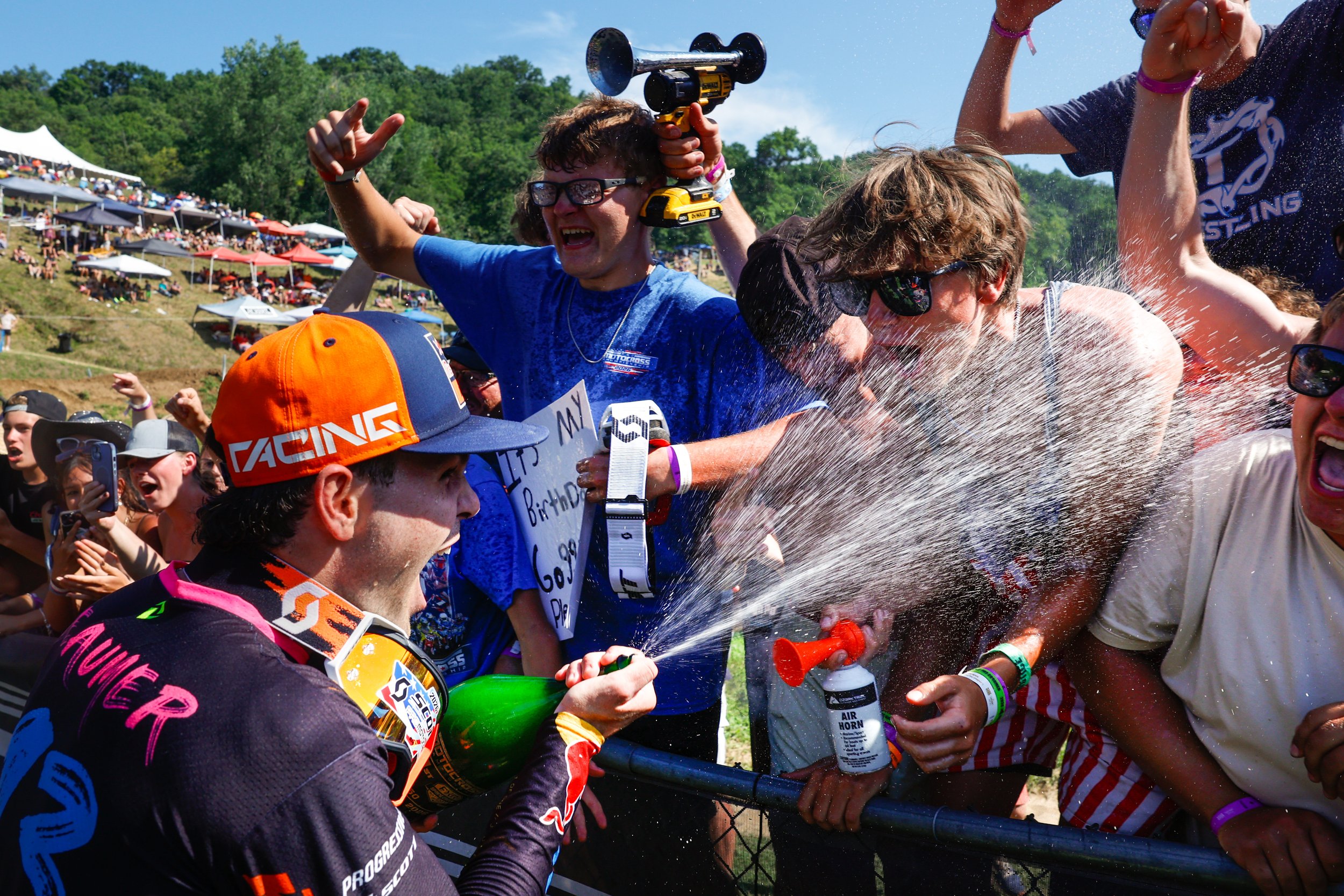 Julian Beaumer (13), winner of the 250 class, sprays fans with champagne during the Spring Creek National on Saturday, July 18, 2026, at Spring Creek MX Park in Millville.
