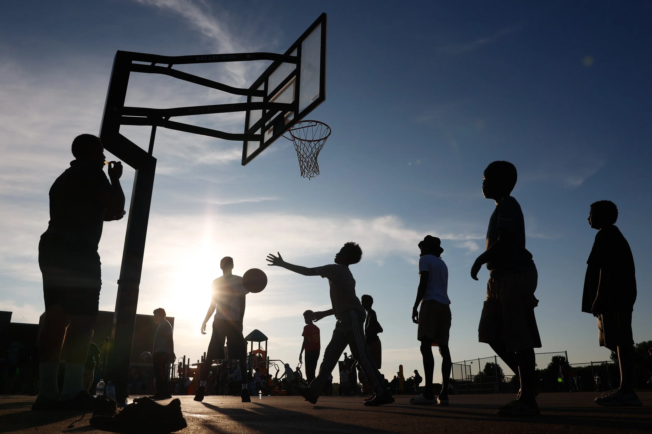 Children play basketball during Rochester Police Department’s Safe City Nights series on Tuesday, June 9, 2026, at Gibbs Elementary School in Rochester.