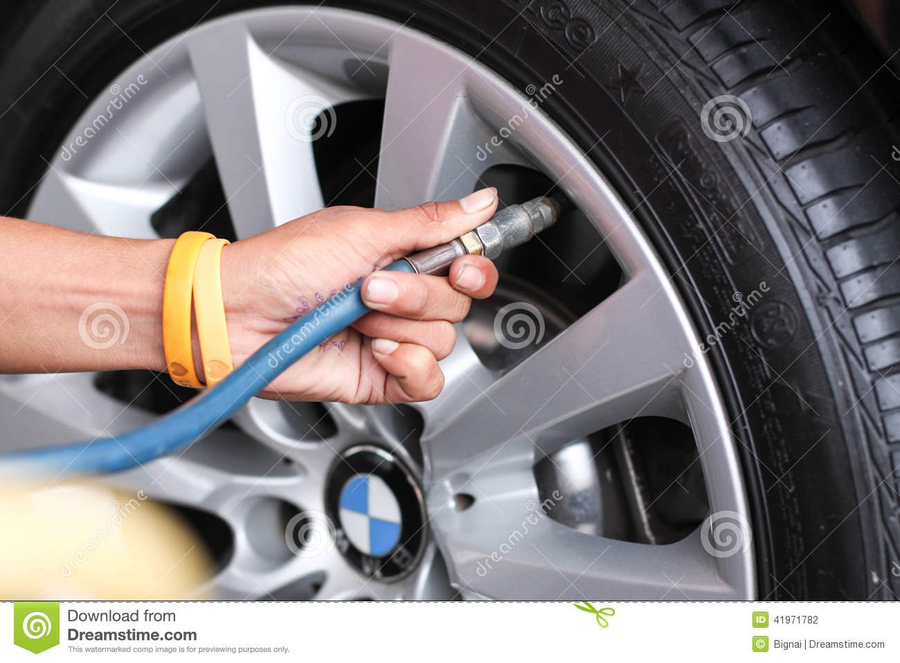 detail-hand-pumping-air-to-tire-increasing-pressure-bangkok-june-bmw-logo-wheels-gas-station-pump-tries-up-41971782.jpeg