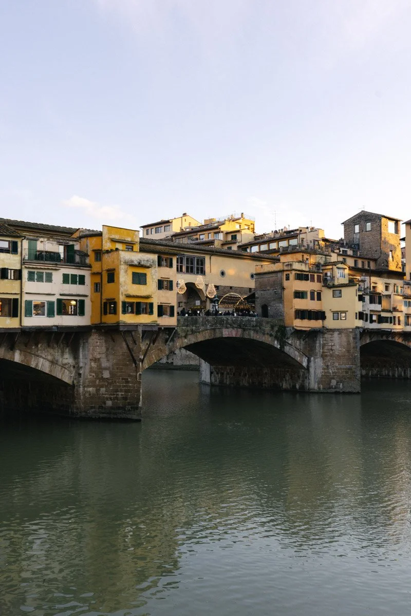 Colorful old buildings on a bridge over a river in Florence, Italy. Travel Photography by Sergio Gutiérrez sergiogutierrezphoto.
