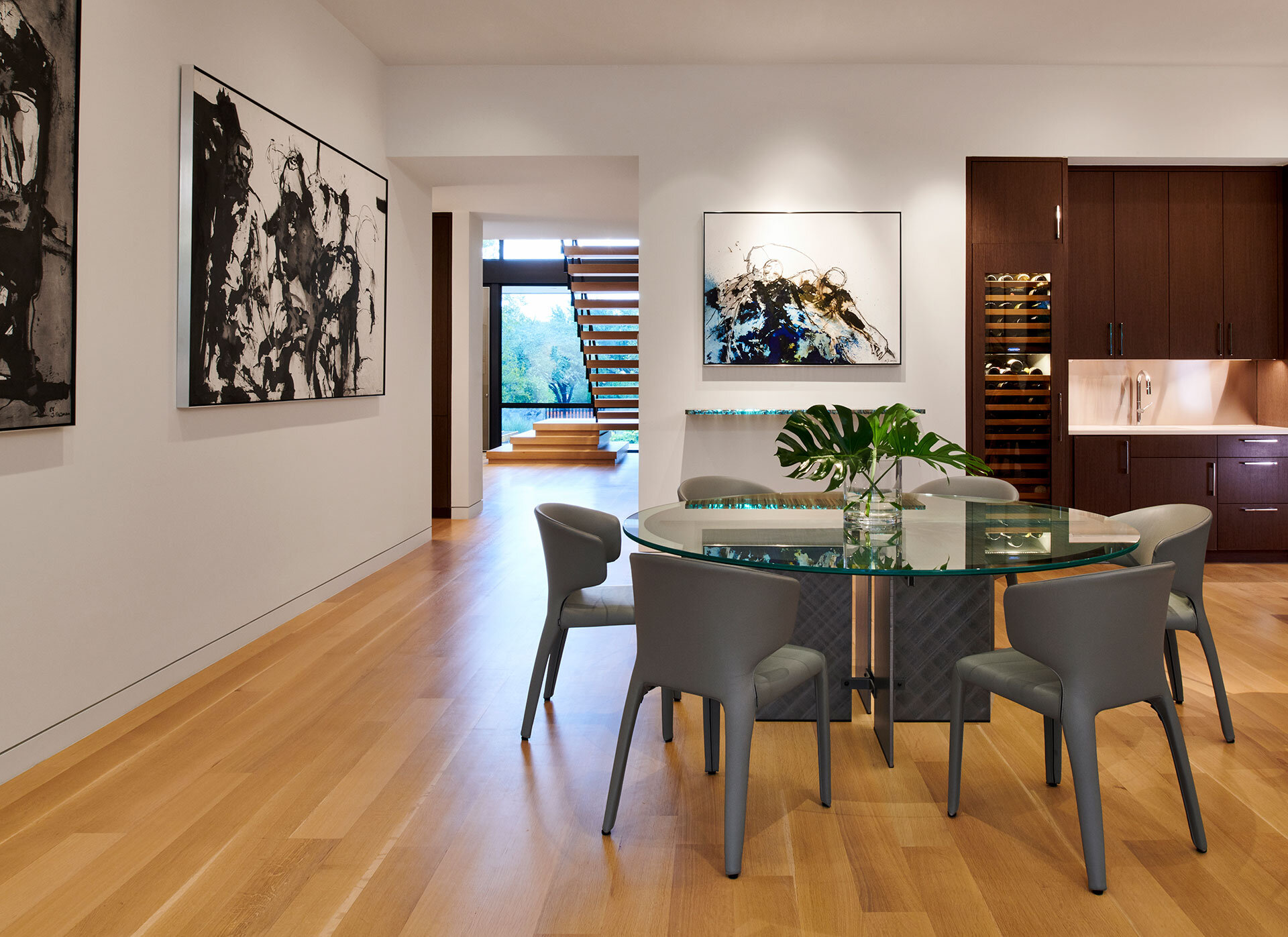  Wood and glass wine cellar on one side of the kitchen 