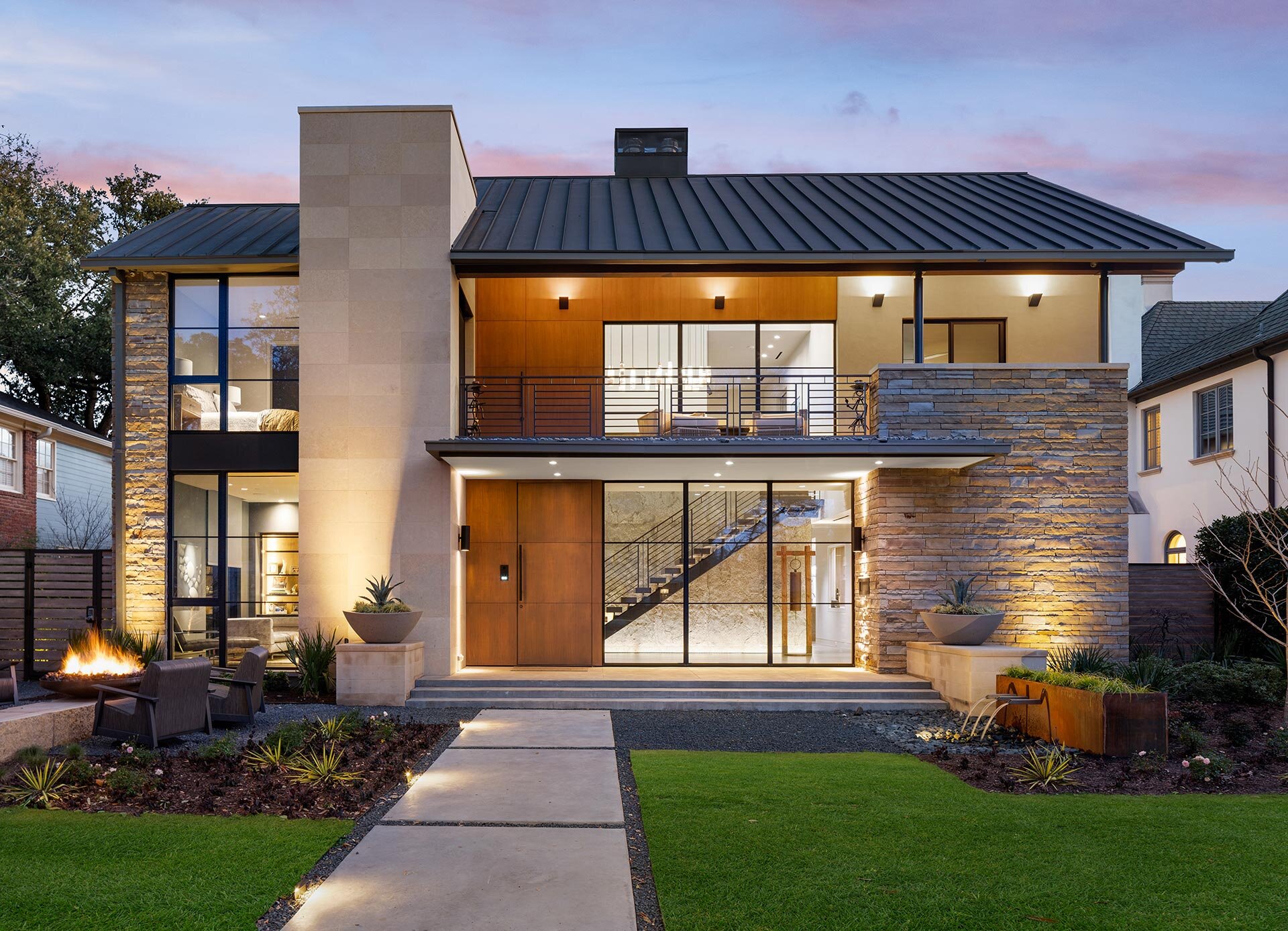  This modern comfortable contemporary home features contemporary execution of Texas vernacular materials of chopped stone, metal roof, wood and stucco 