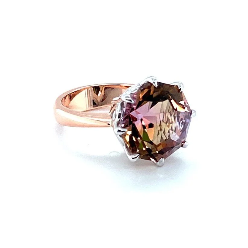 A Bolivian Ametrine cocktail ring that reminds us of a sunset.  This is a designer cut Ametrine and is just over 10 ct in size. 