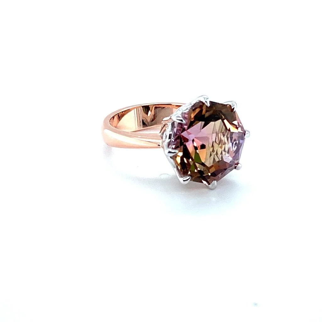 Rose & white gold cocktail ring featuring a 10ct ametrine.  This ring has a swirl gallery which is hard to see in this picture.  If you would like to see more angles of any of these pictures send us a message through our contact page. 