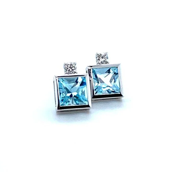 Beautiful white gold aquamarine and diamond studs.  We can custom make you a similar set in the gemstone of your choice. 