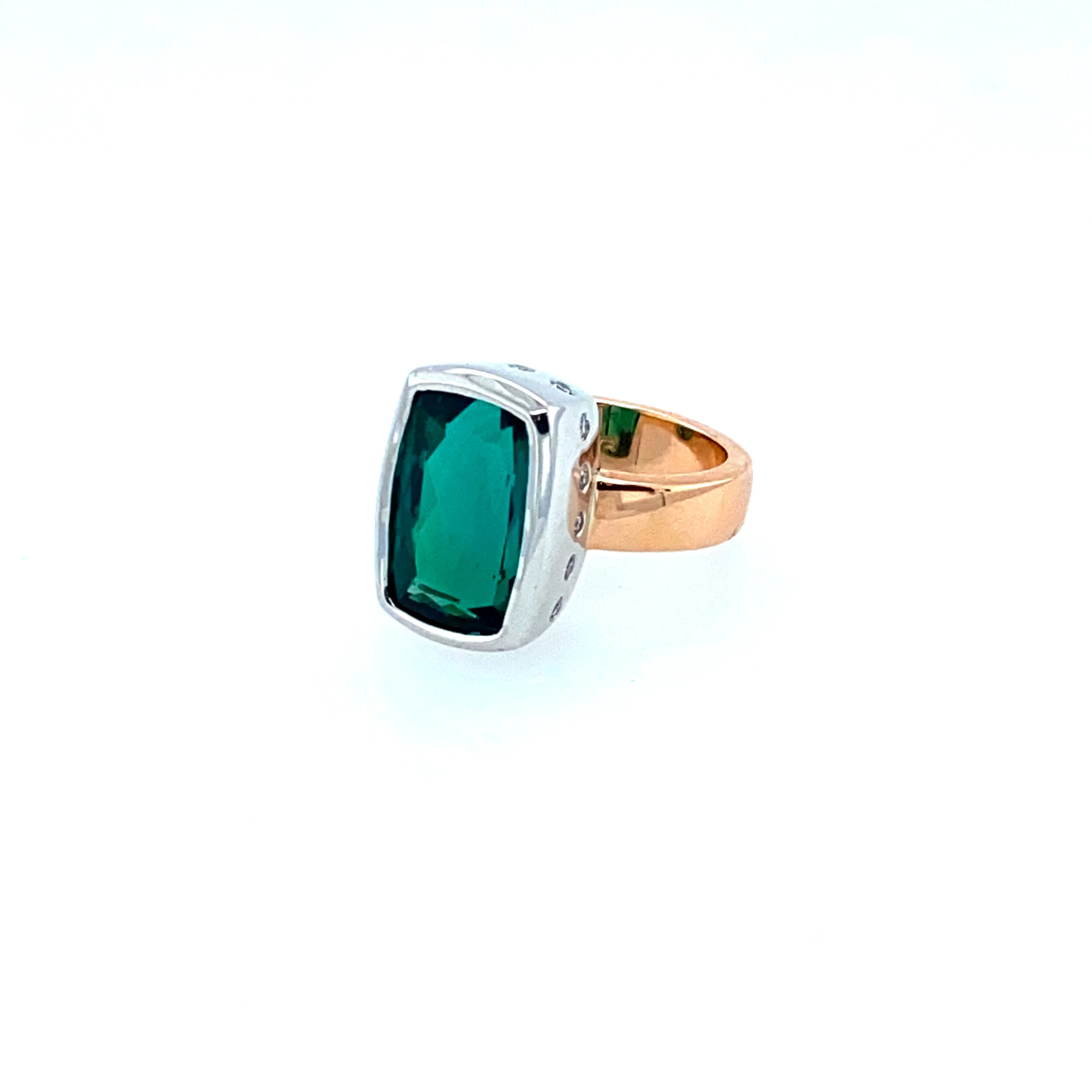 8.50ct blue green tourmaline set in 18ct rose & white gold.  This ring also feaures 0.02ct hammer set diamonds aroudn the bezel.  (Currently Available)