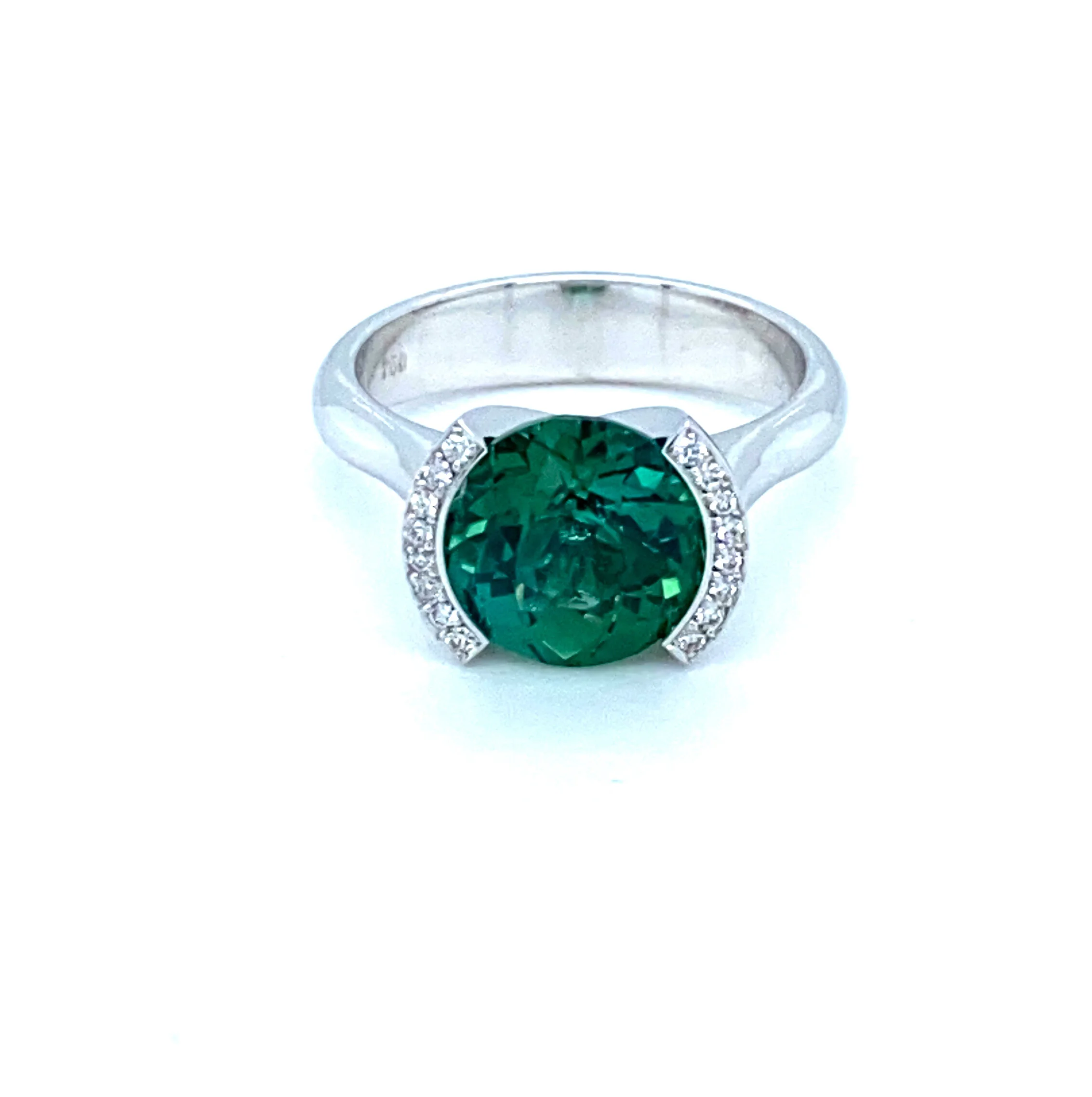 We love this 3.98ct Congo peacock green tourmaline.  It is a round flower cut and you can really see it when you gaze down into the gem.  This ring is 18ct white gold with pave diamonds.  (Currently Available)