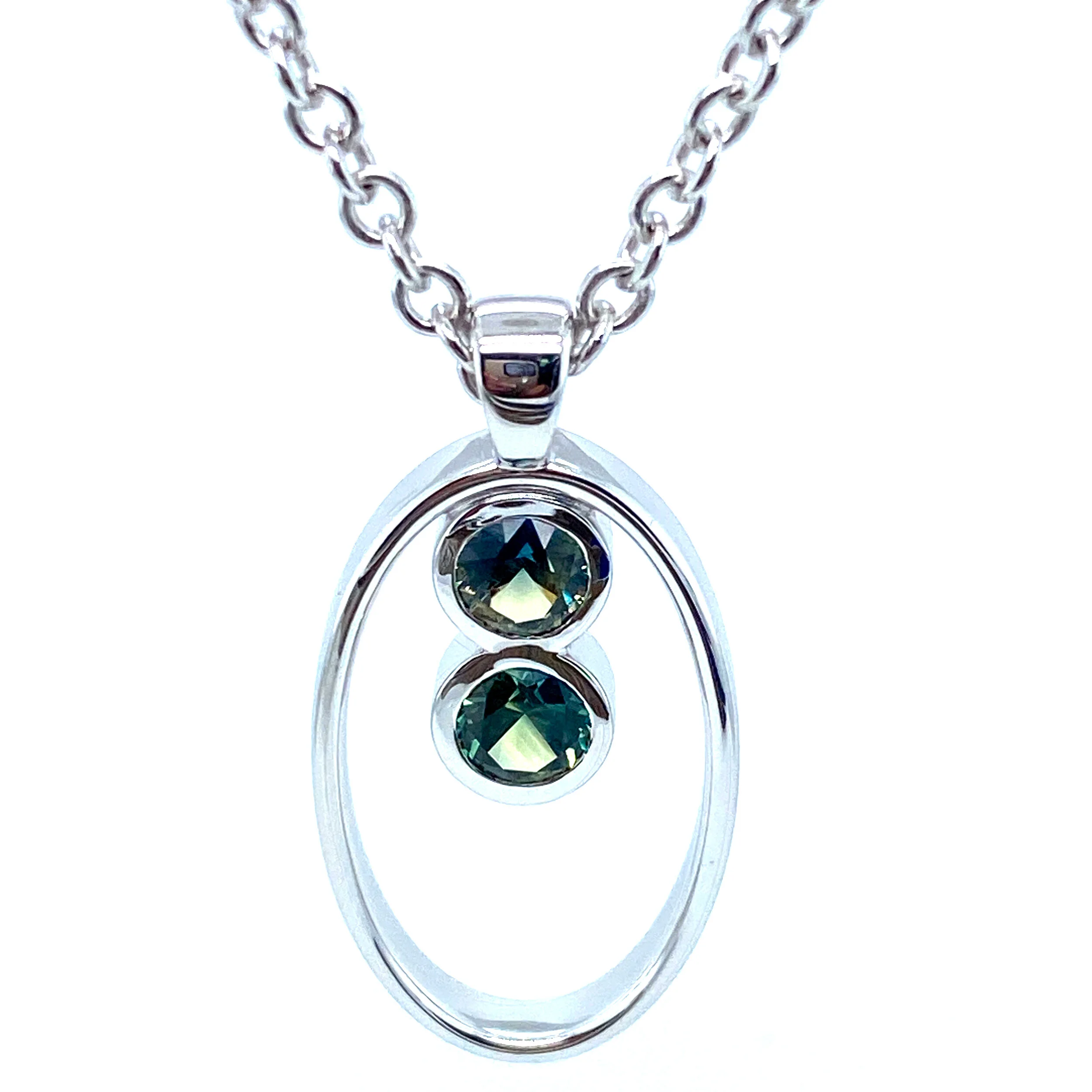 Remodel using white gold and a client's lovely Australian parti sapphires.  If you have any gems sitting around our jewellery remodelling service can help turn them ino something new.  