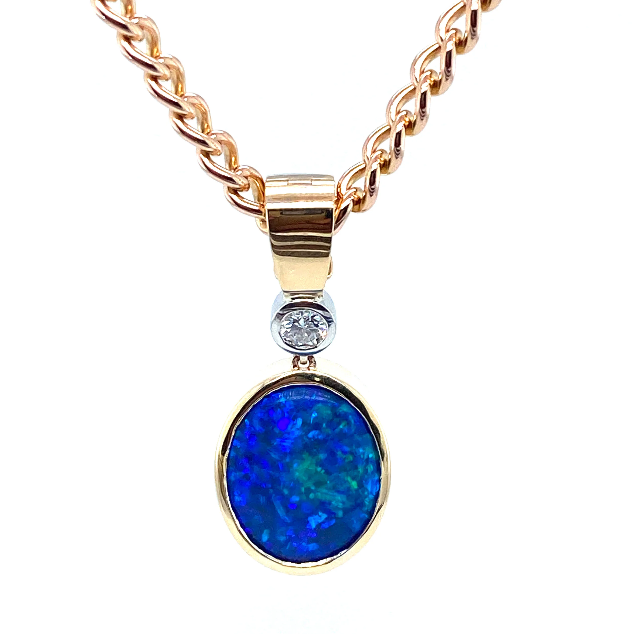 18ct yellow & white gold were used to make this beautiful pendant.  A 0.25ct diamond sits just above a stunning example of a Lightning Ridge Opal. 