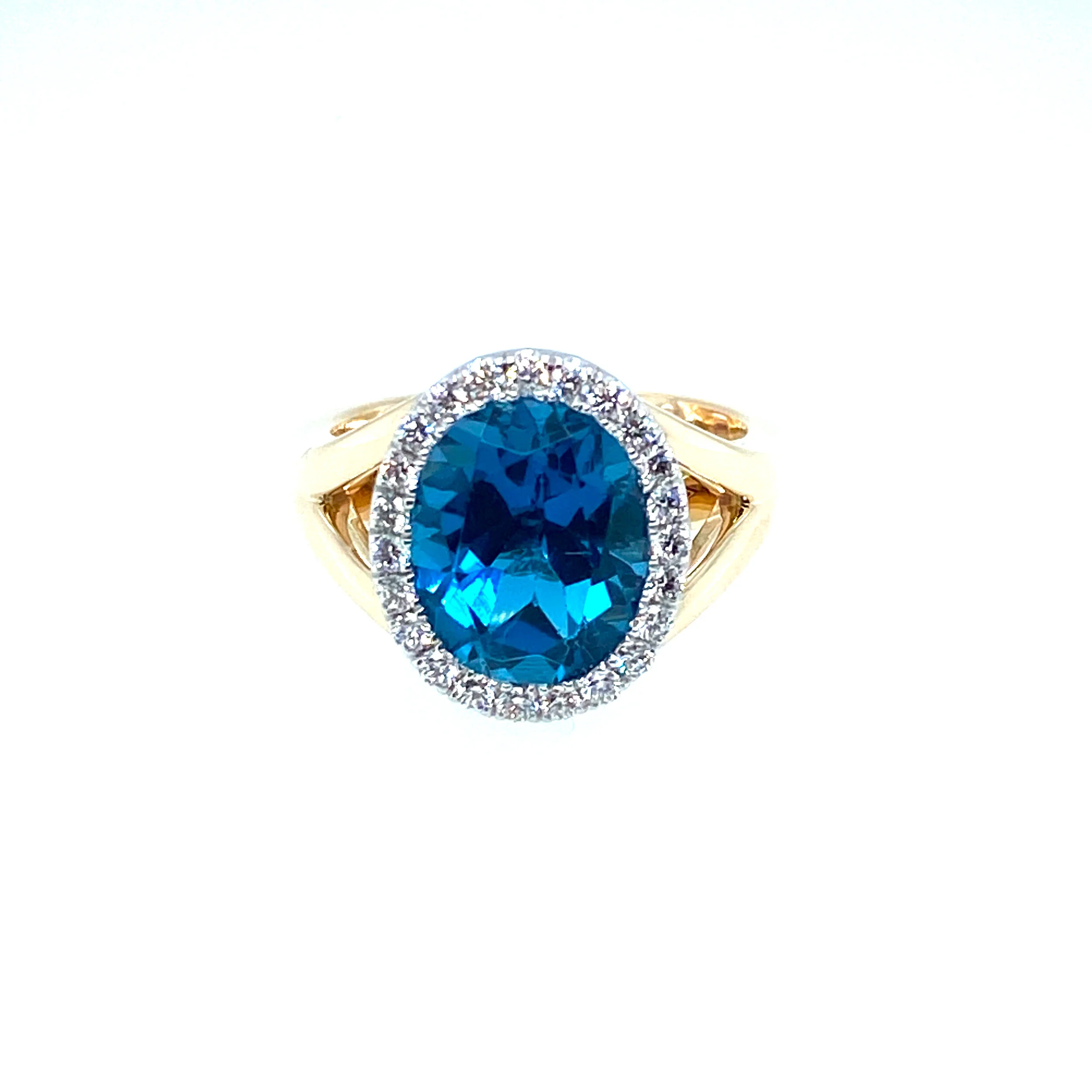 South Sea topaz with diamond halo in white and yellow gold. 