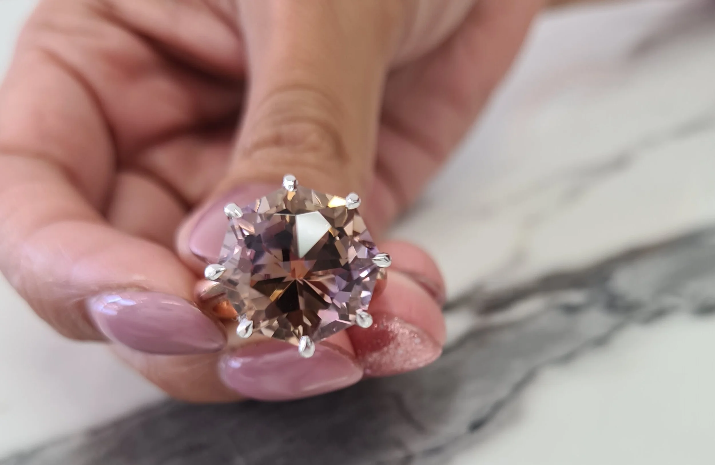 A 10ct fancy cut Bolivian Ametrine used in this stunning  cocktail ring .