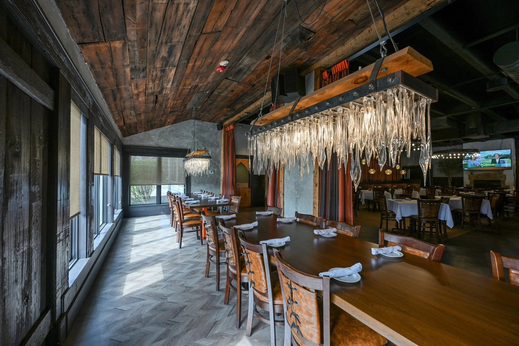 Burntwood Tavern private dining room with hand-blown glass chandelier and reclaimed wood table