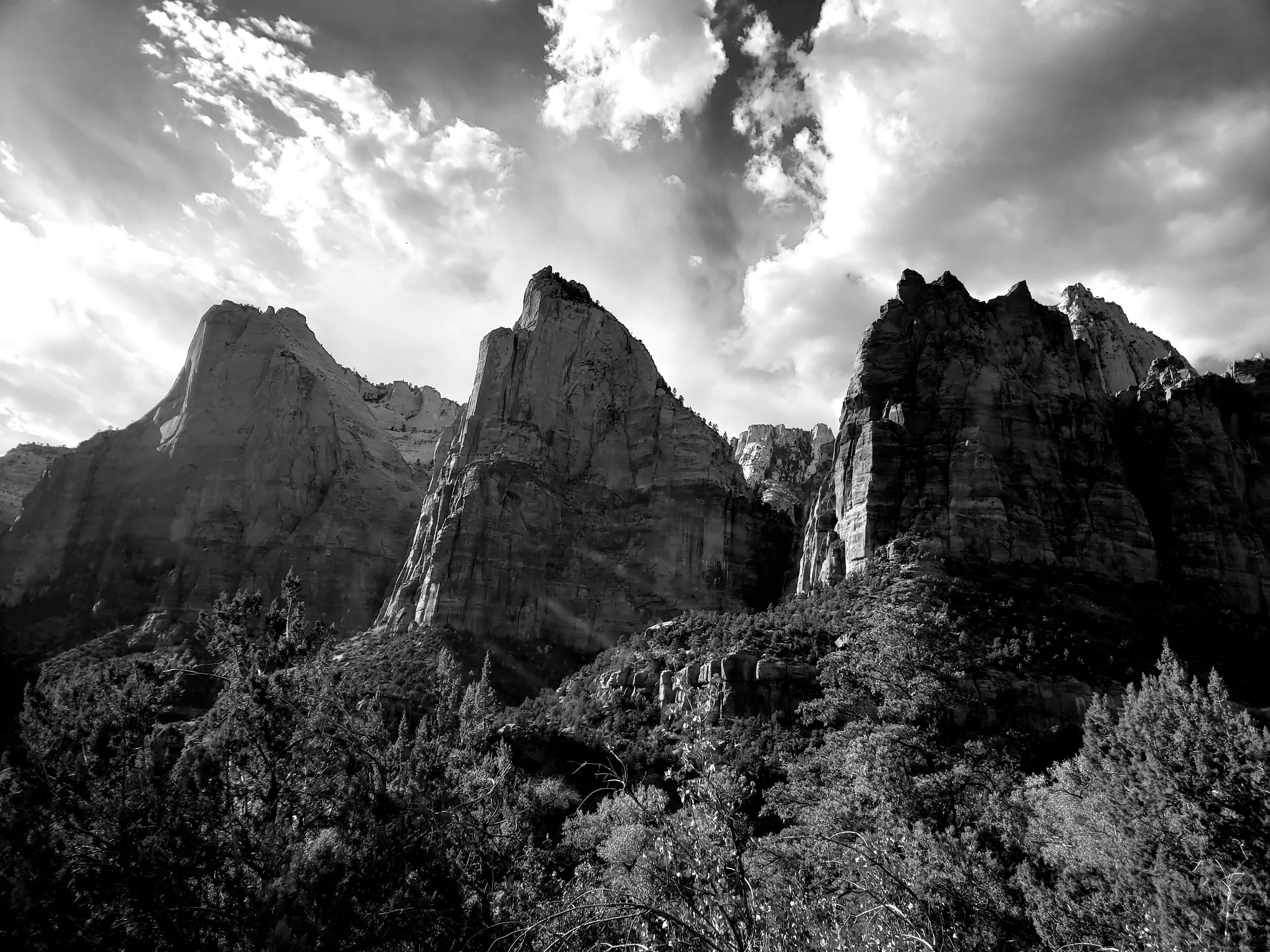 Zion National Park is a funny place. You can see amazingly beautiful rock formations like the Court of the Patriarchs (lots of biblical references here) but behind me is a bus stop crowded with tourists.