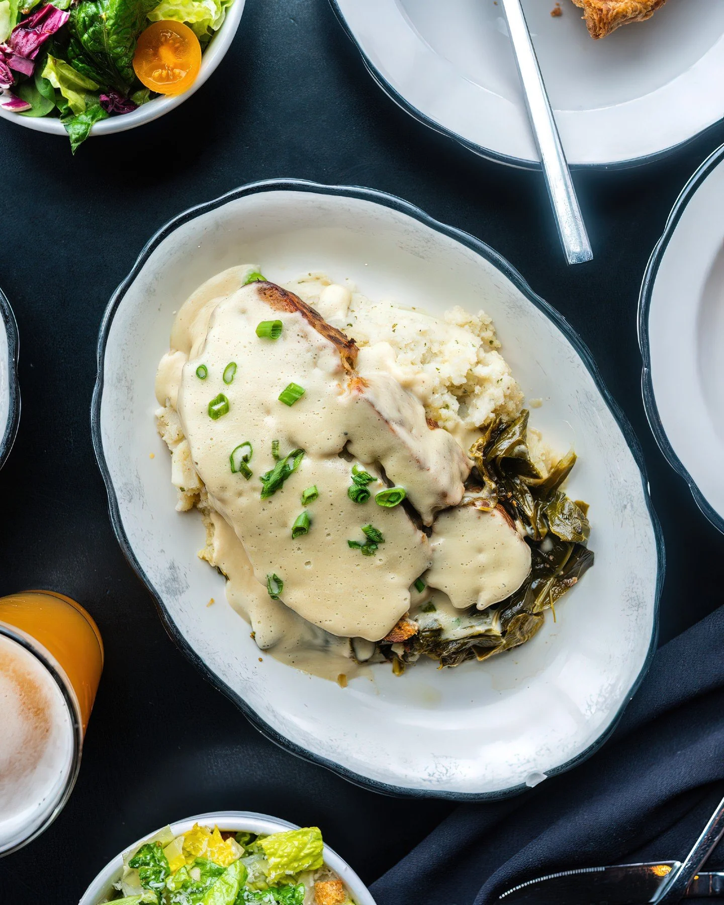 Cooler weather calls for comfort food. ✨

Pictured: our meatloaf drizzled in sweet onion gravy, served with braised greens and mashed potatoes. The season&rsquo;s officially on.